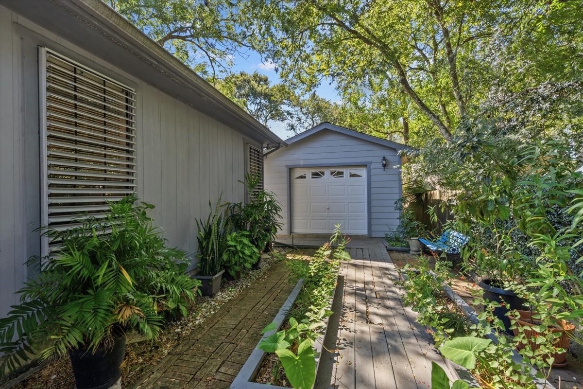 Walkway around the house and heated/cooled workshop in backyard.