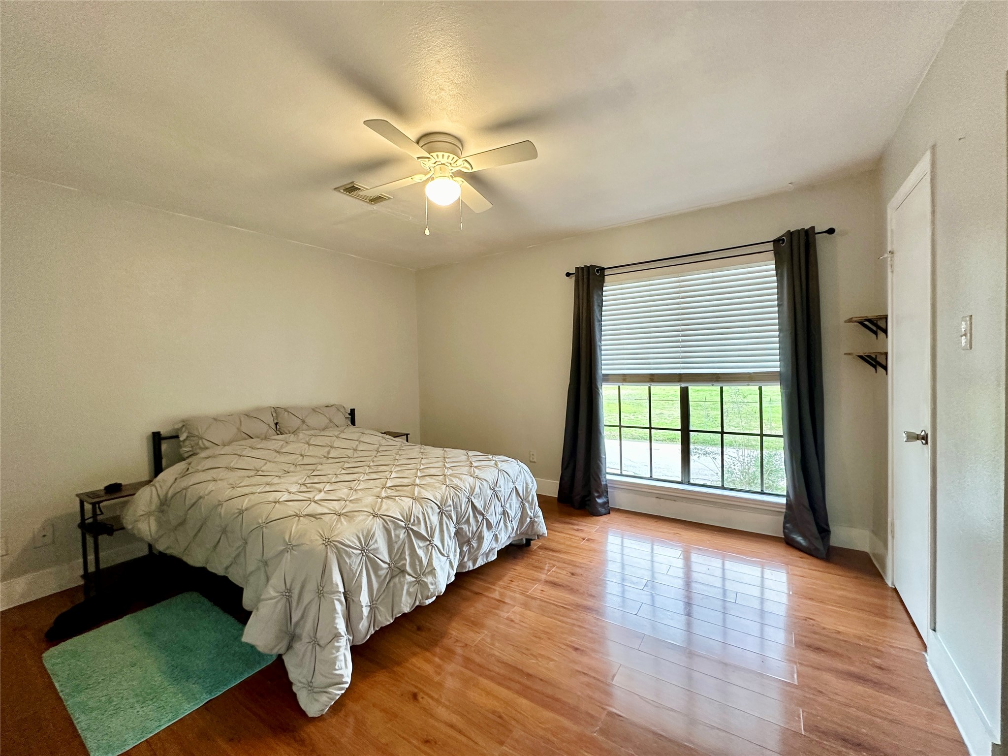 Primary bedroom upstairs features good natural lighting and nice closet space.