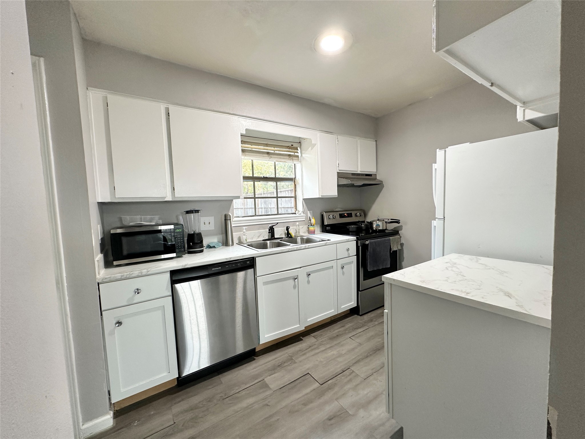 Kitchen with faux marble countertops and everything you need! Window overlooks the backyard. Kitchen with faux marble countertops and everything you need! Window overlooks the backyard.