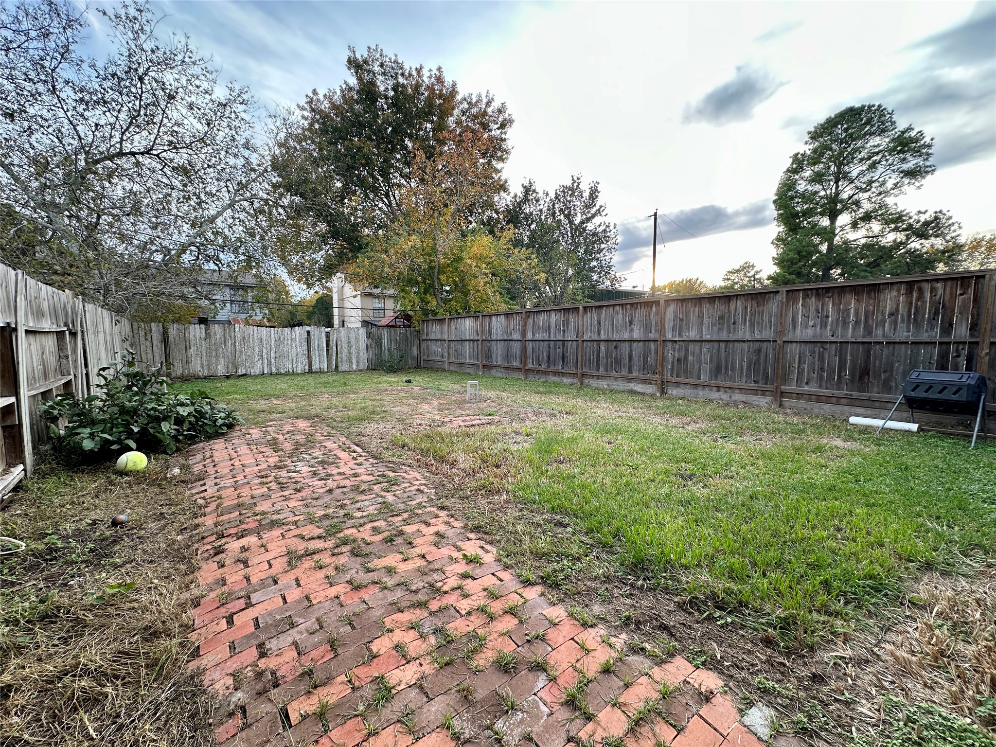 Large fenced backyard included.