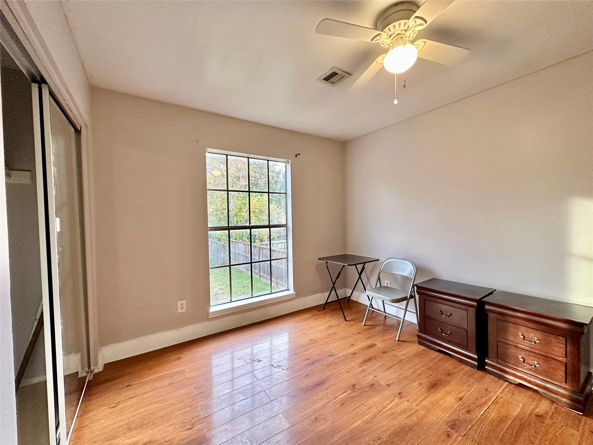 Secondary bedroom on second floor is nice and bright overlooking backyard.