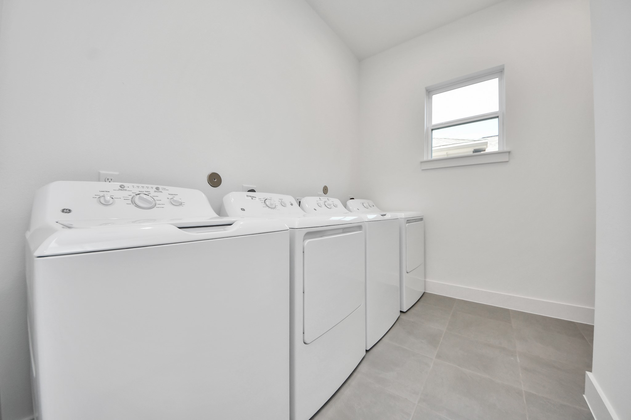 Unit B laundry room with washer and dryer.