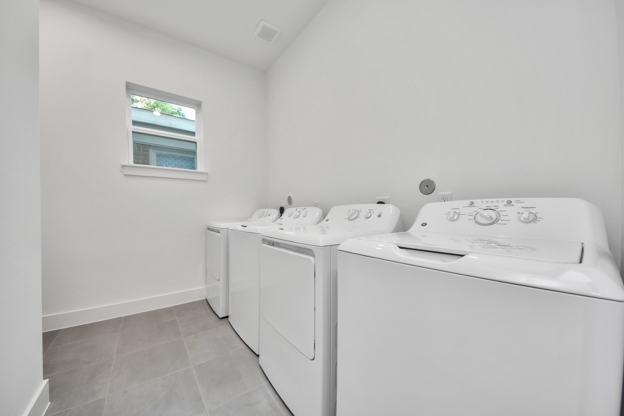 Unit A laundry room with washer and dryer.