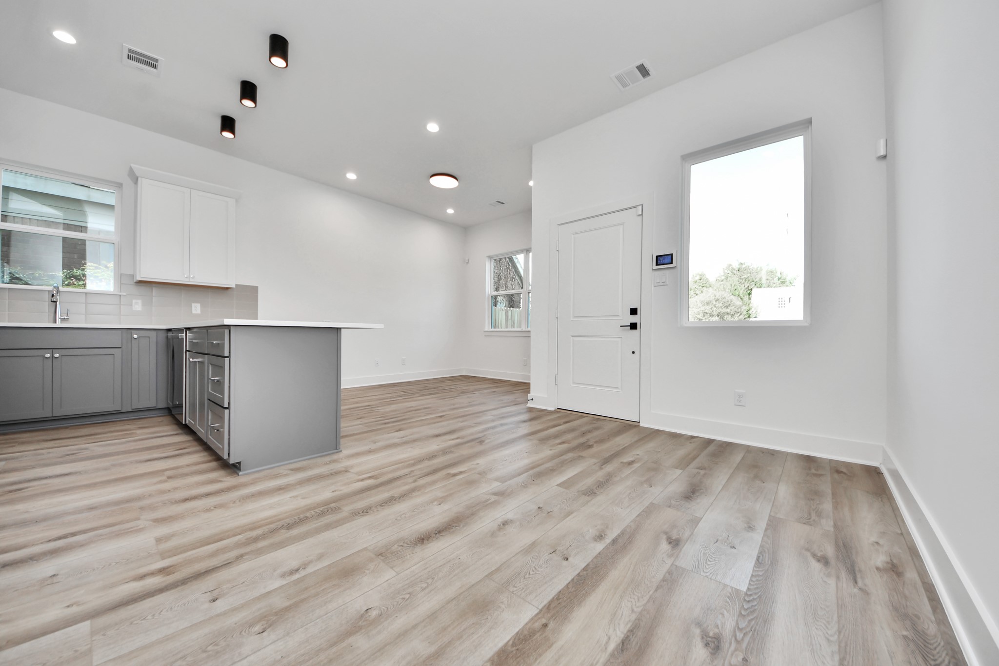 Unit A spacious open-concept layout featuring modern finishes and natural light. Unit A spacious open-concept layout featuring modern finishes and natural light.
