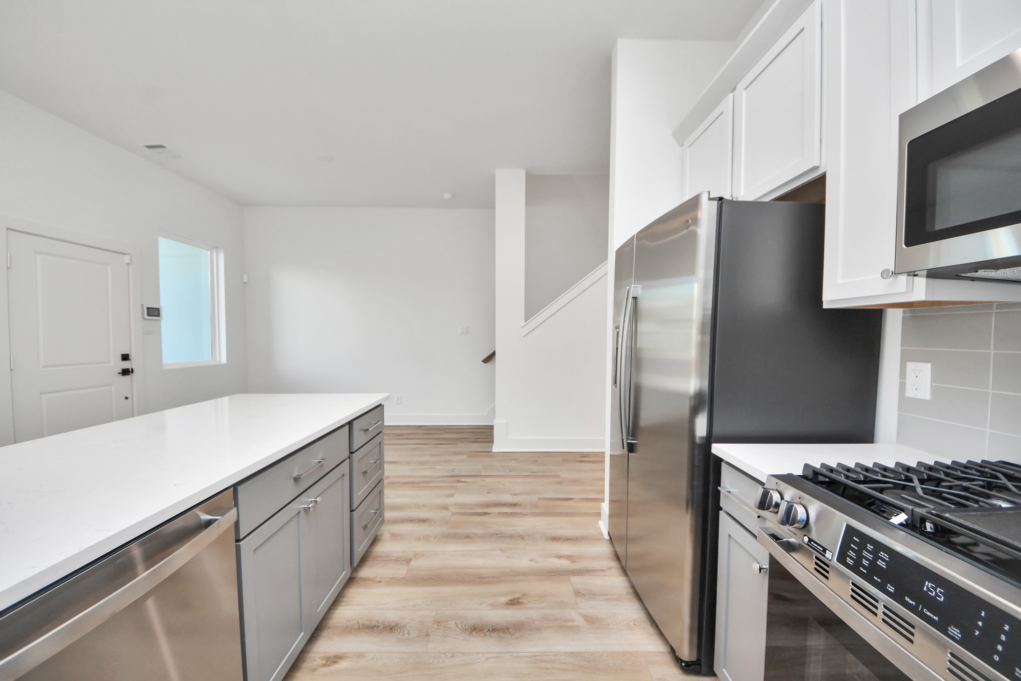 Unit A kitchen overlooking the dining area. Unit A kitchen overlooking the dining area.