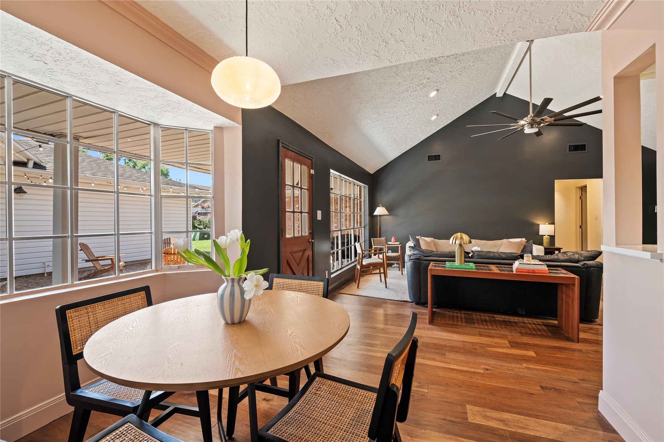 Another view of the breakfast area with views into the back yard. Open to the large living room.