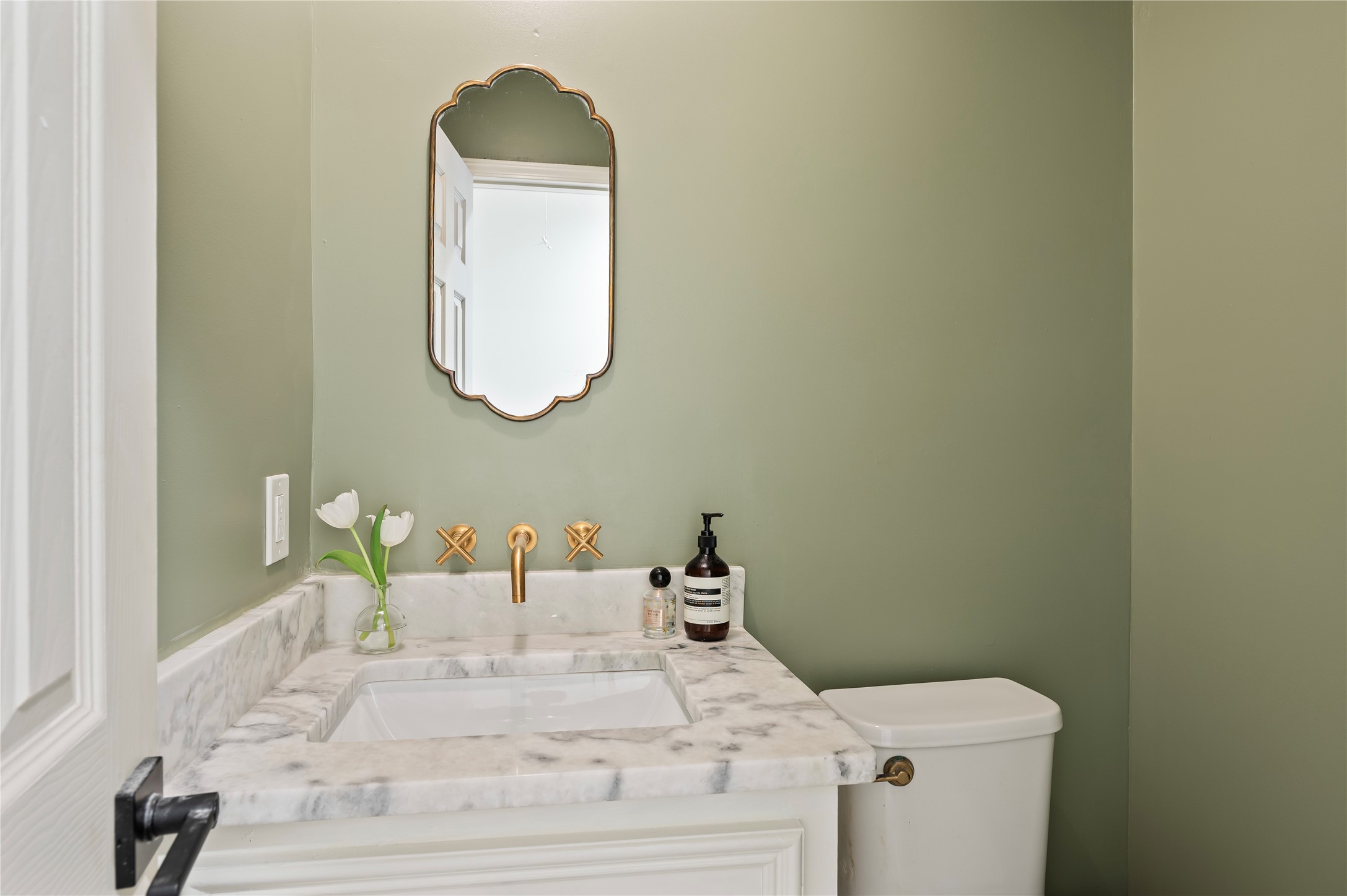 Beautiful half bath situated near the living room.