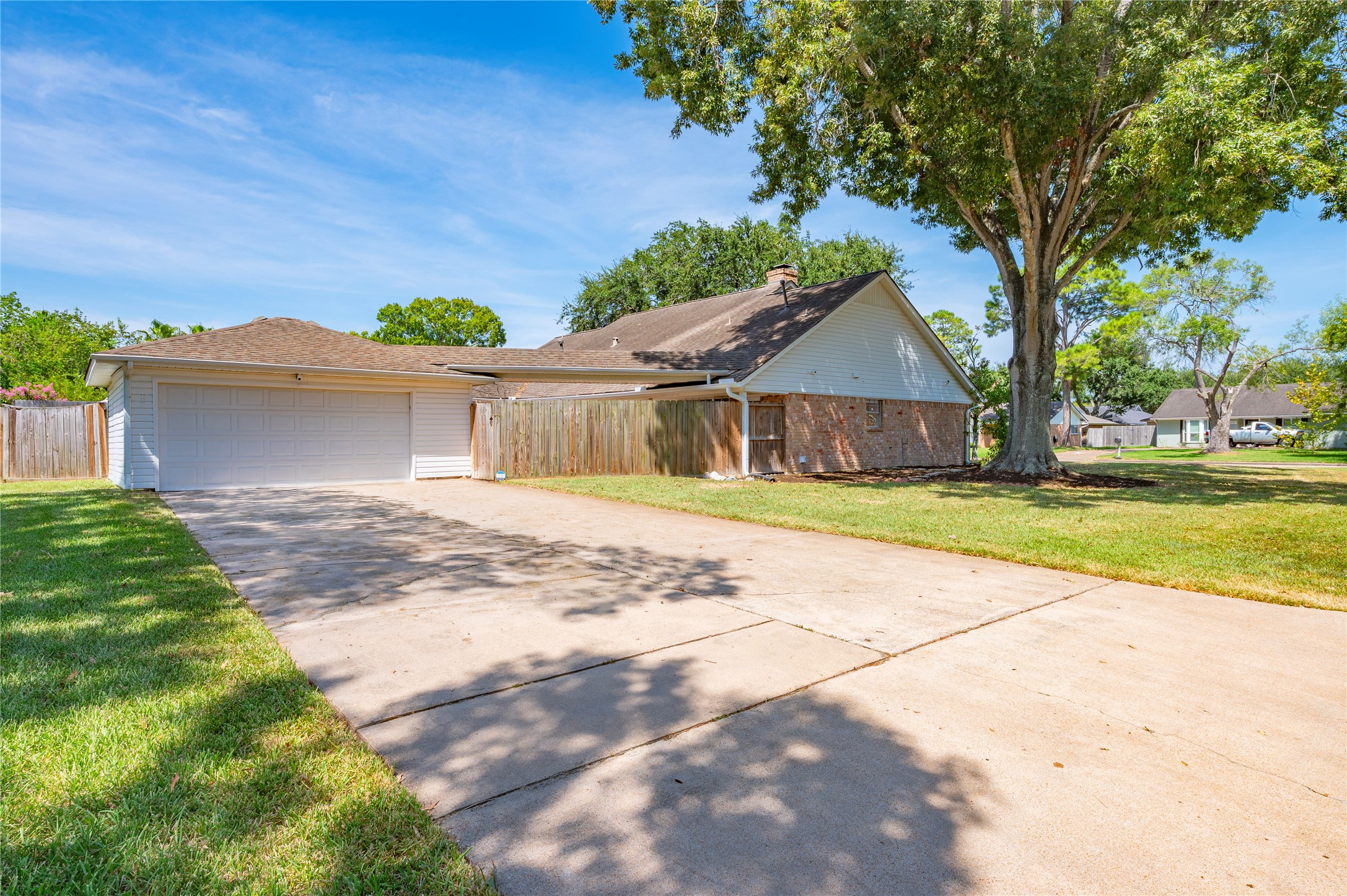 Double wide driveway leads to the 2 car detached garage. Ample parking on the large driveway.