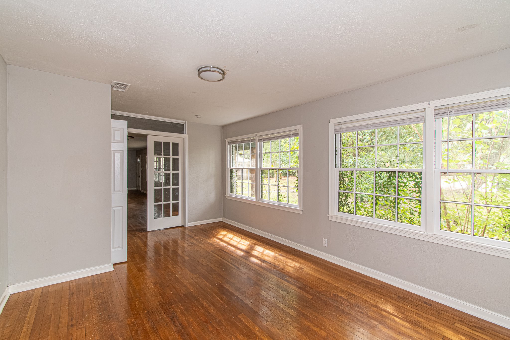 This flex room could function as an extra bedroom, a study, or a formal dining room.
