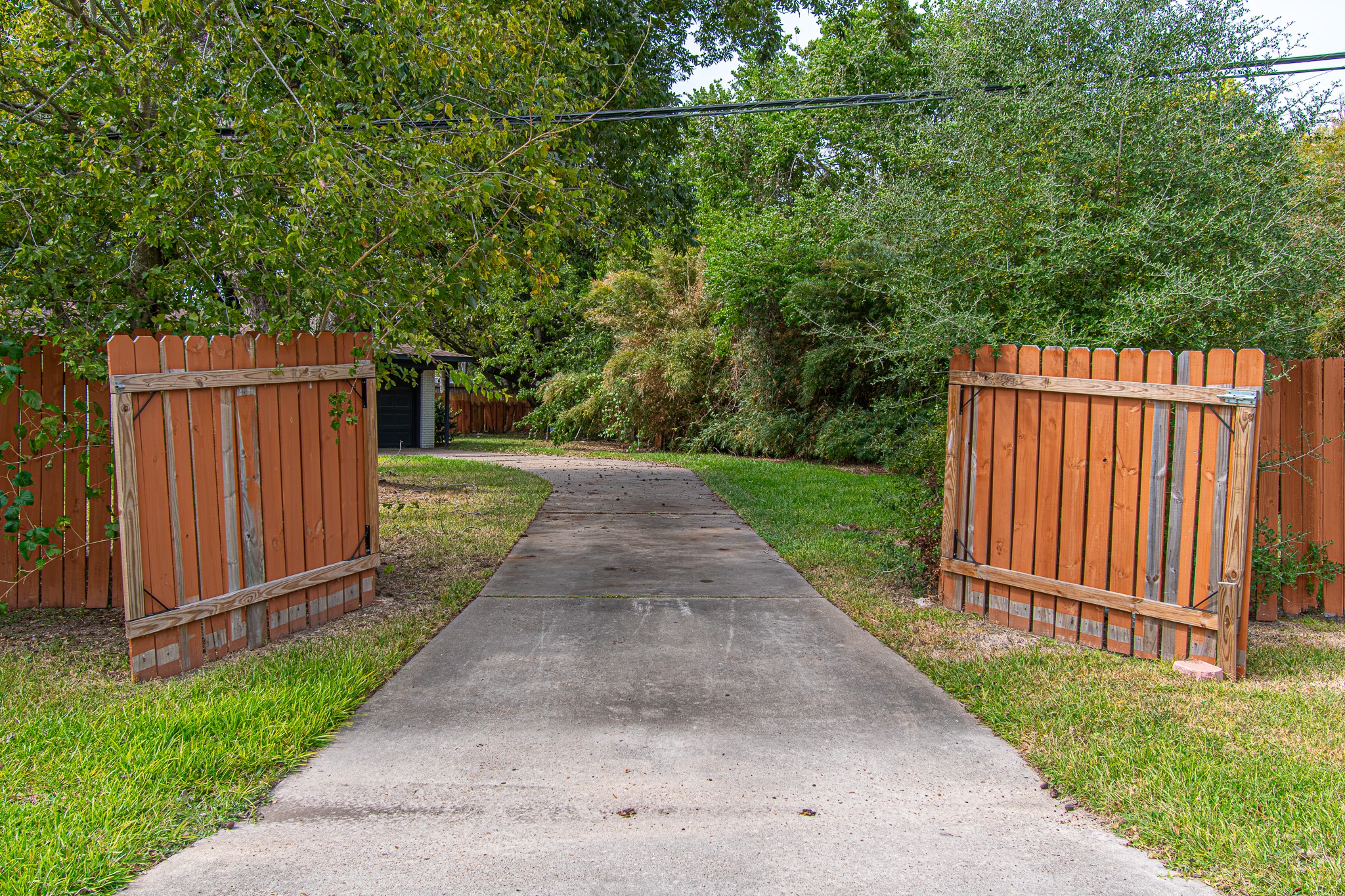 Driveway Gate to the back entrance, driveway, and garage.