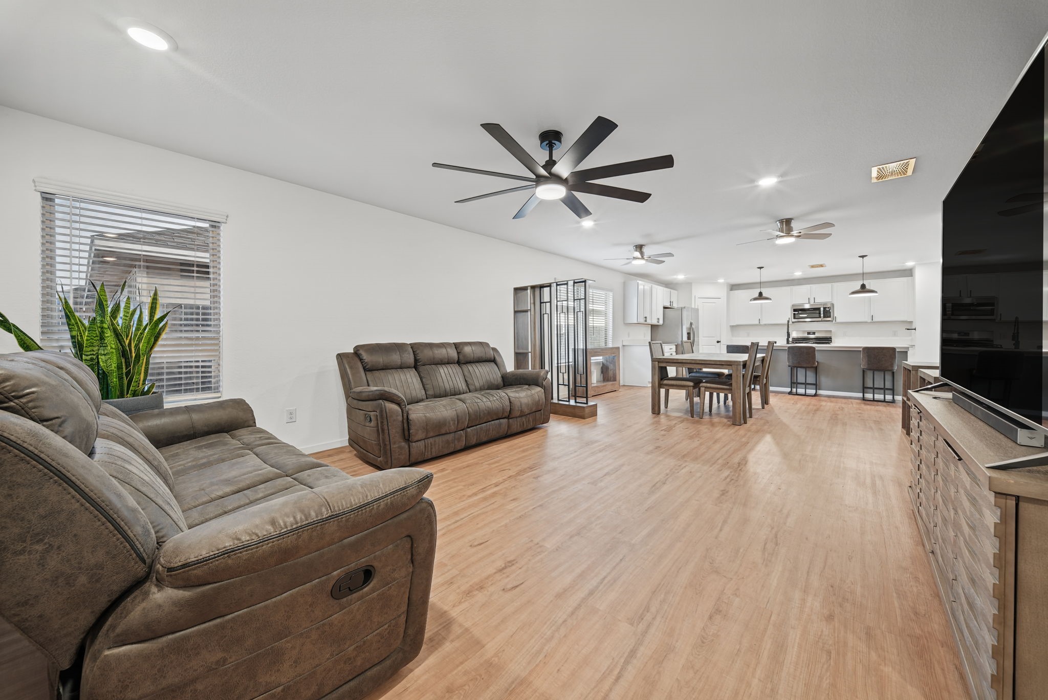 Step inside to a SPACIOUS OPEN-CONCEPT family room, dining area and kitchen, creating the perfect space for everyday living and entertaining! Step inside to a SPACIOUS OPEN-CONCEPT family room, dining area and kitchen, creating the perfect space for everyday living and entertaining!