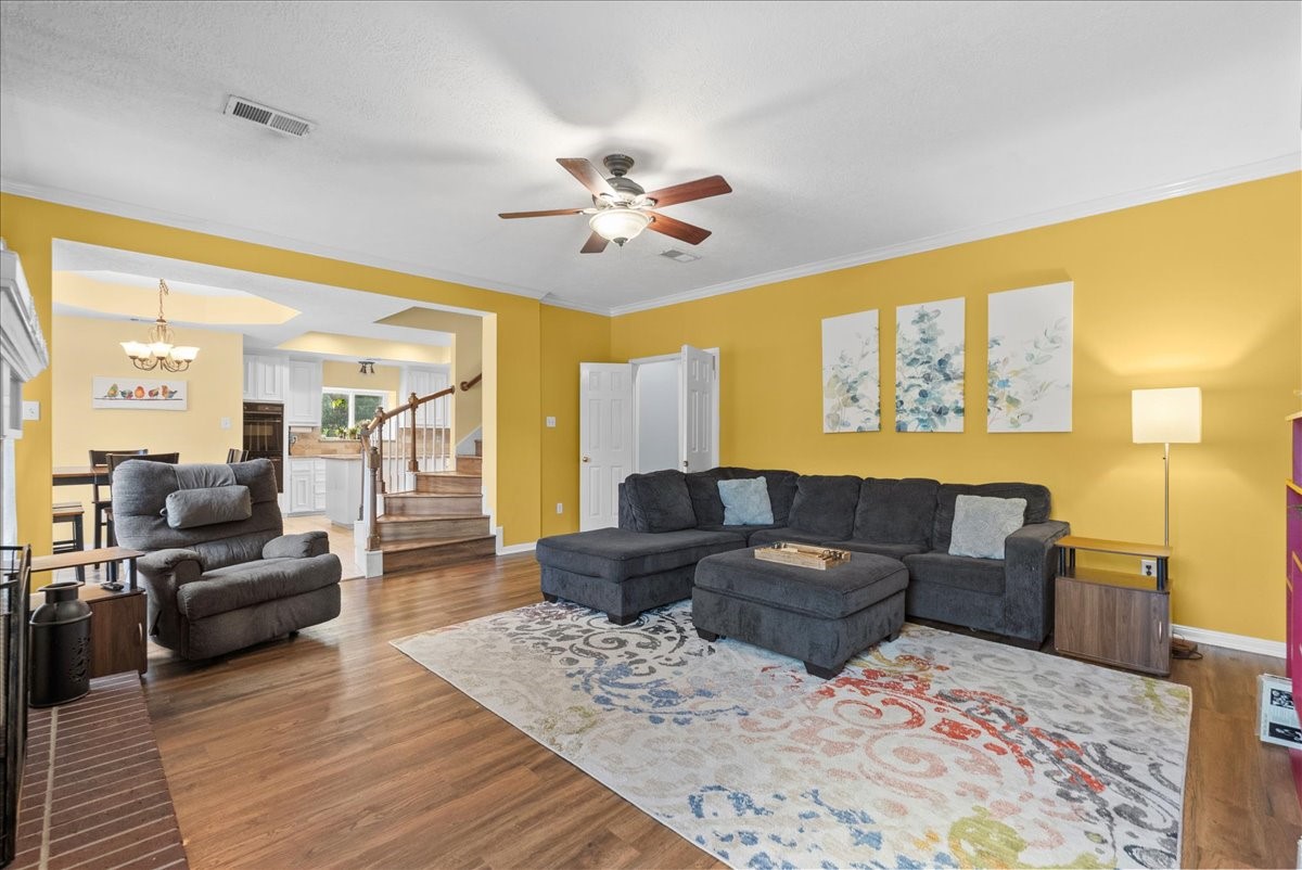 The living area sits towards the back of the home overlooking your sparkling pool.