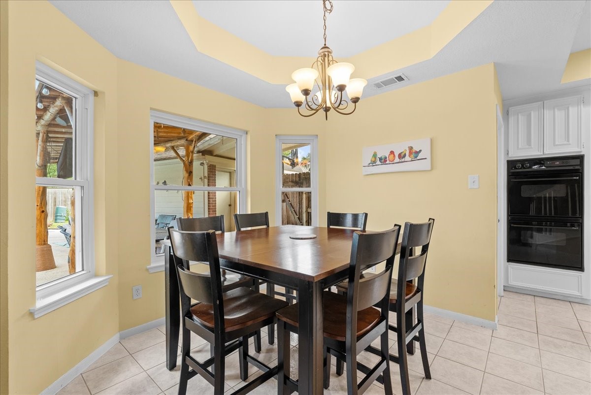 Notice the tray ceilings, and updated bay windows that complete the breakfast area.