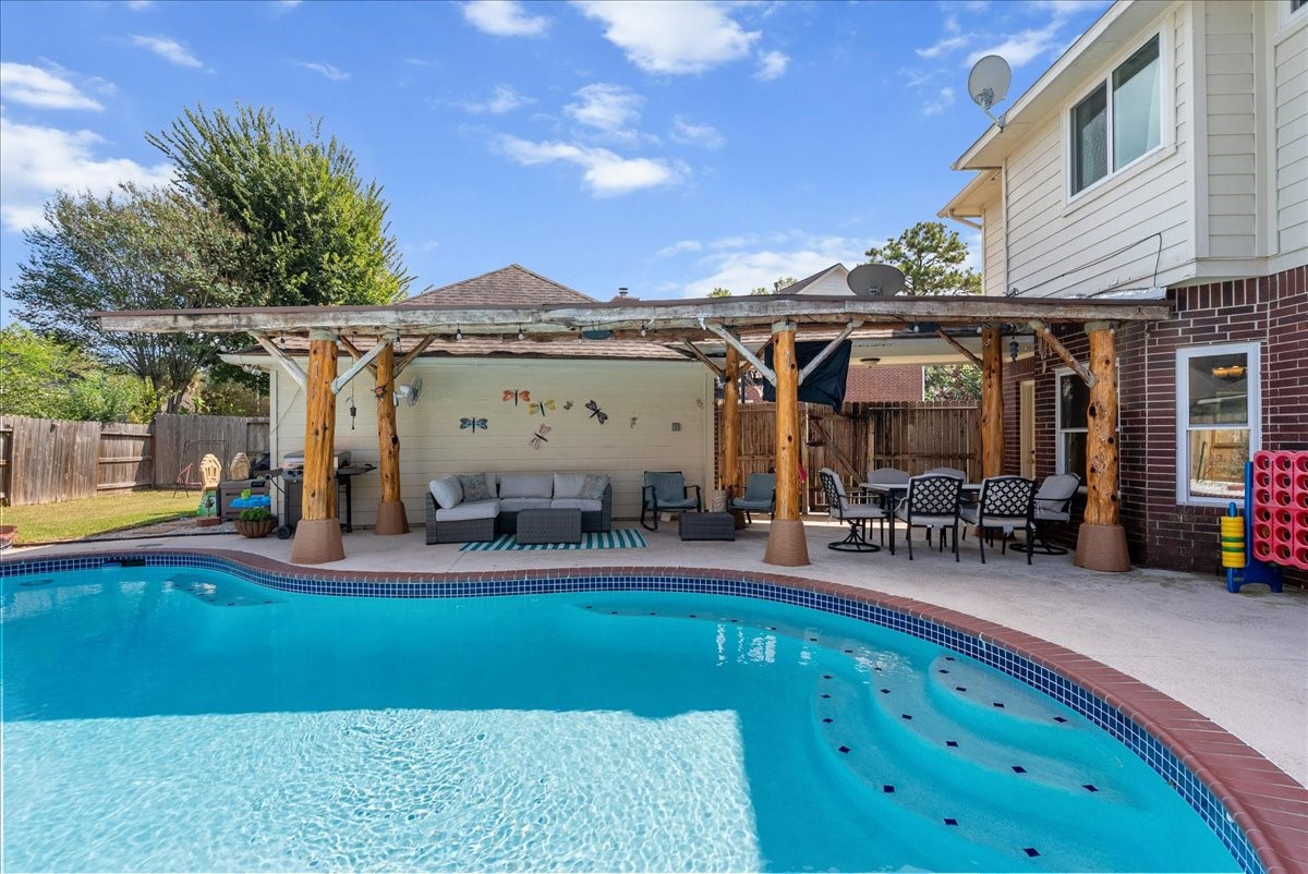 Check out that sparkling pool and oversized palapa.