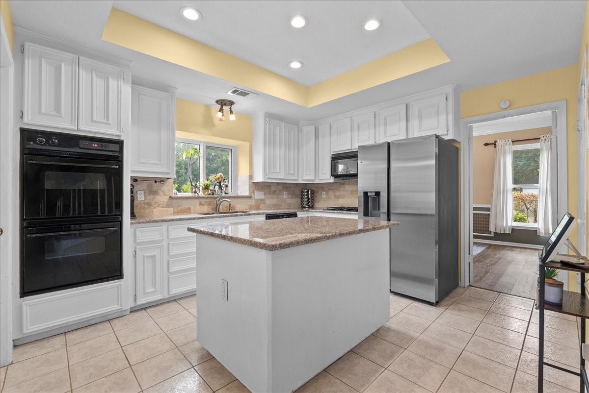 The kitchen evens offers a granite island.