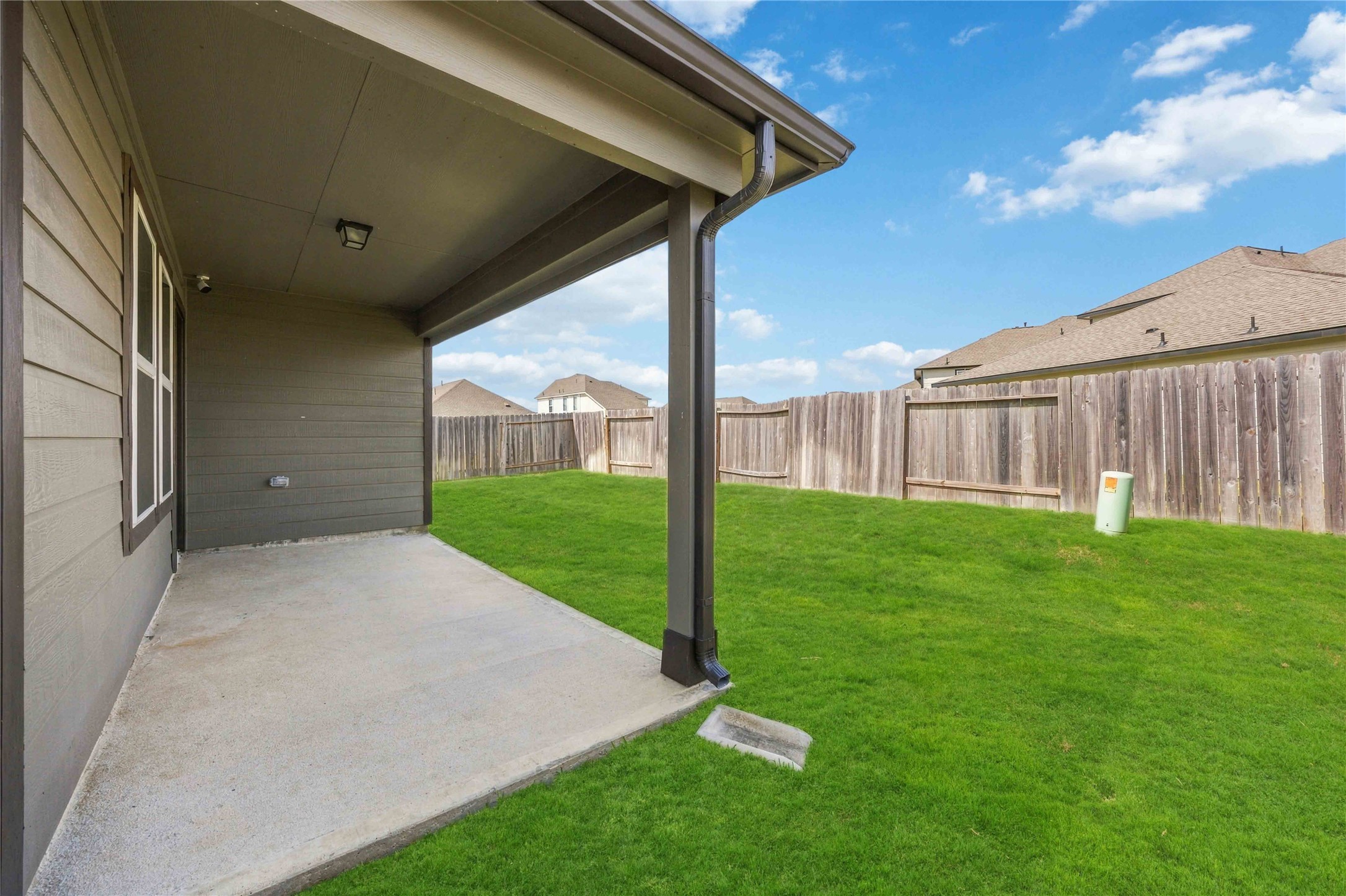 Covered back patio for grilling and entertaining!