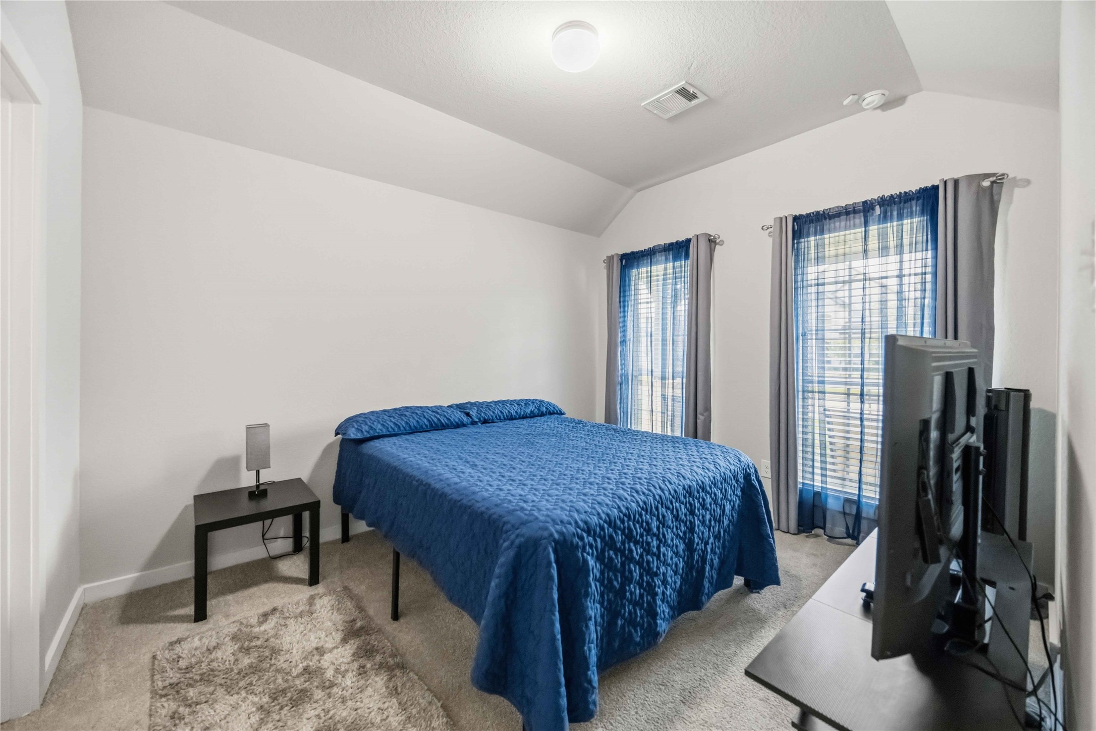 Secondary bedroom with an en-suite bathroom. This could be an amazing space for your next guest, college student or parent. You choose!