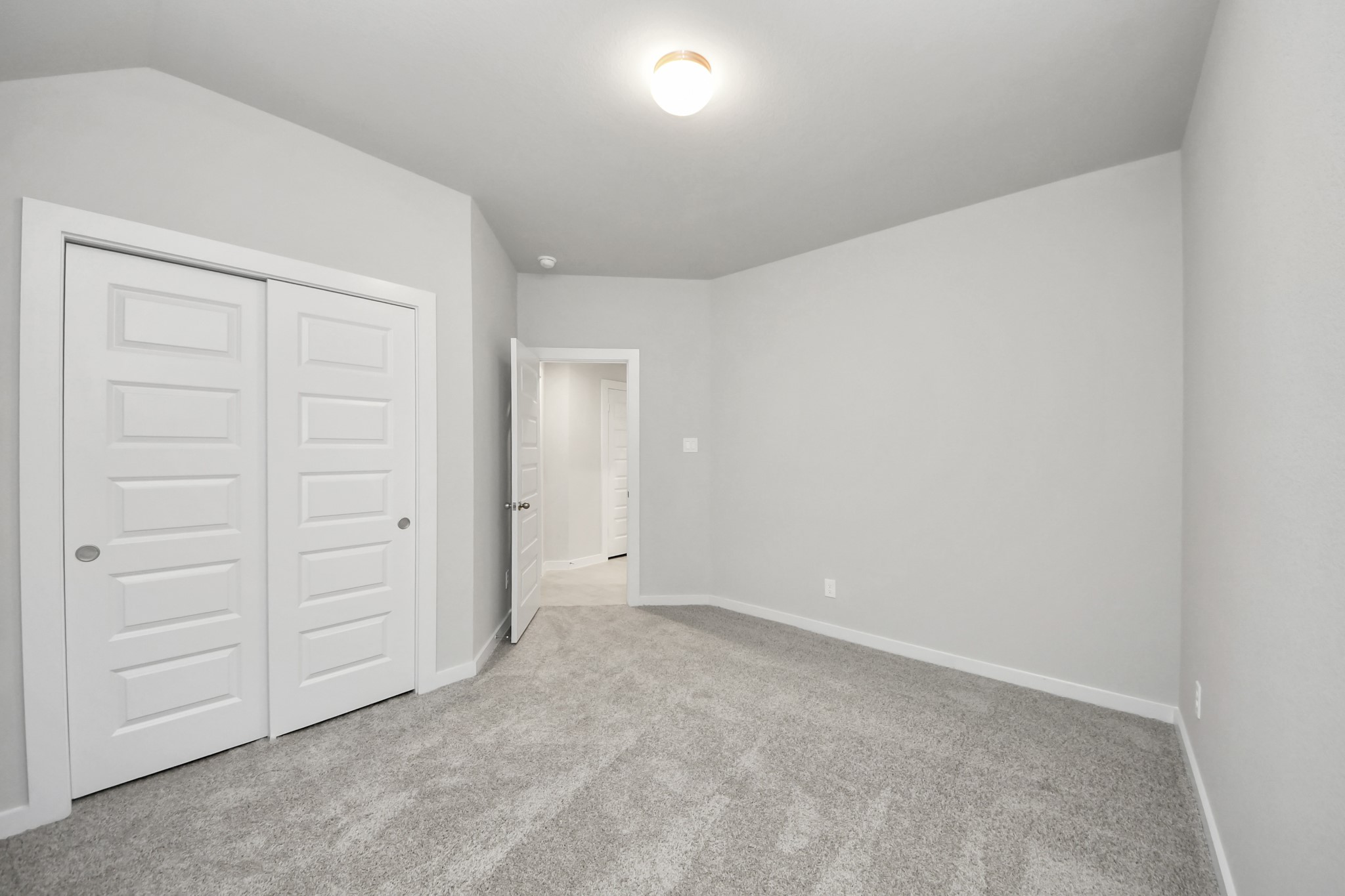 Generously sized secondary bedrooms featuring spacious closets, soft and inviting carpeting underfoot, large windows allowing plenty of natural light, and the added touch of privacy blinds for your personal retreat. Sample photo of completed home with similar floor plan. Actual colors and selections may vary.