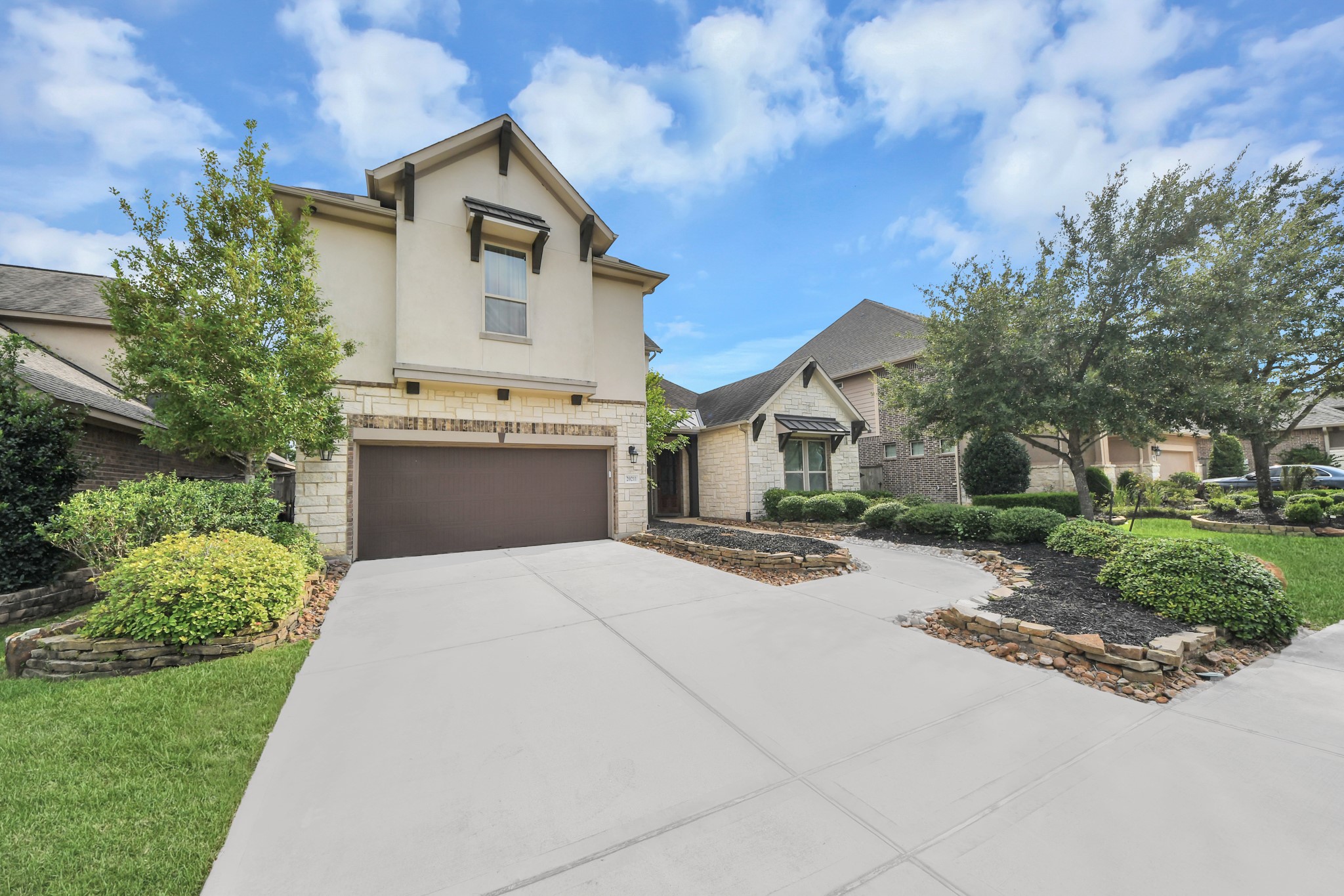 Striking front elevation showcased at twilight with warm exterior lighting and an inviting covered entry. Striking front elevation showcased at twilight with warm exterior lighting and an inviting covered entry.