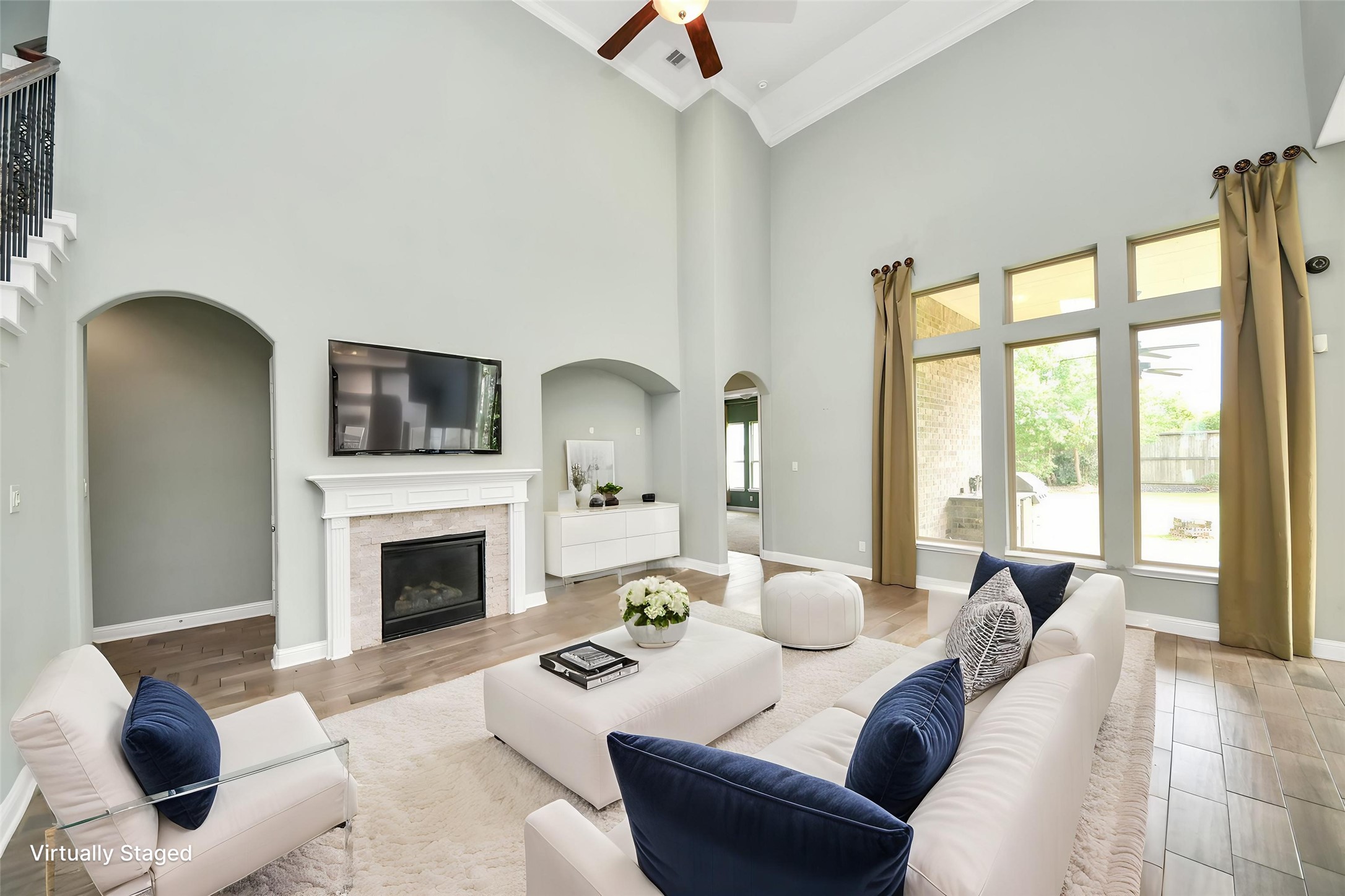 Virtually Staged Soaring ceilings, fireplace, oversized windows, and virtual staging showcase the impressive main living area. Virtually Staged Soaring ceilings, fireplace, oversized windows, and virtual staging showcase the impressive main living area.
