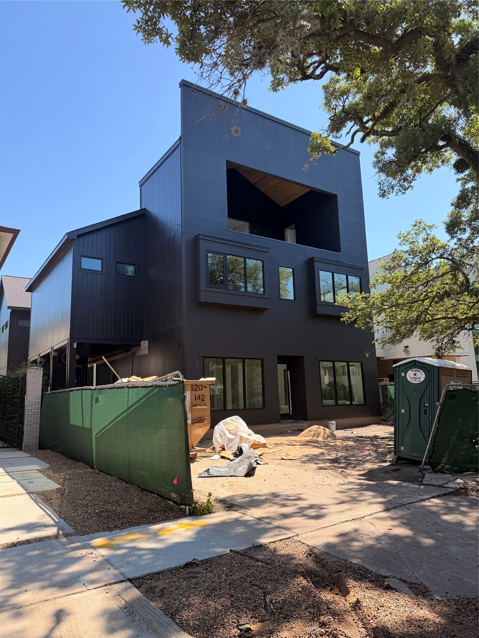 Elevated front with third level game room and theater room and glass enclosed terrace Elevated front with third level game room and theater room and glass enclosed terrace