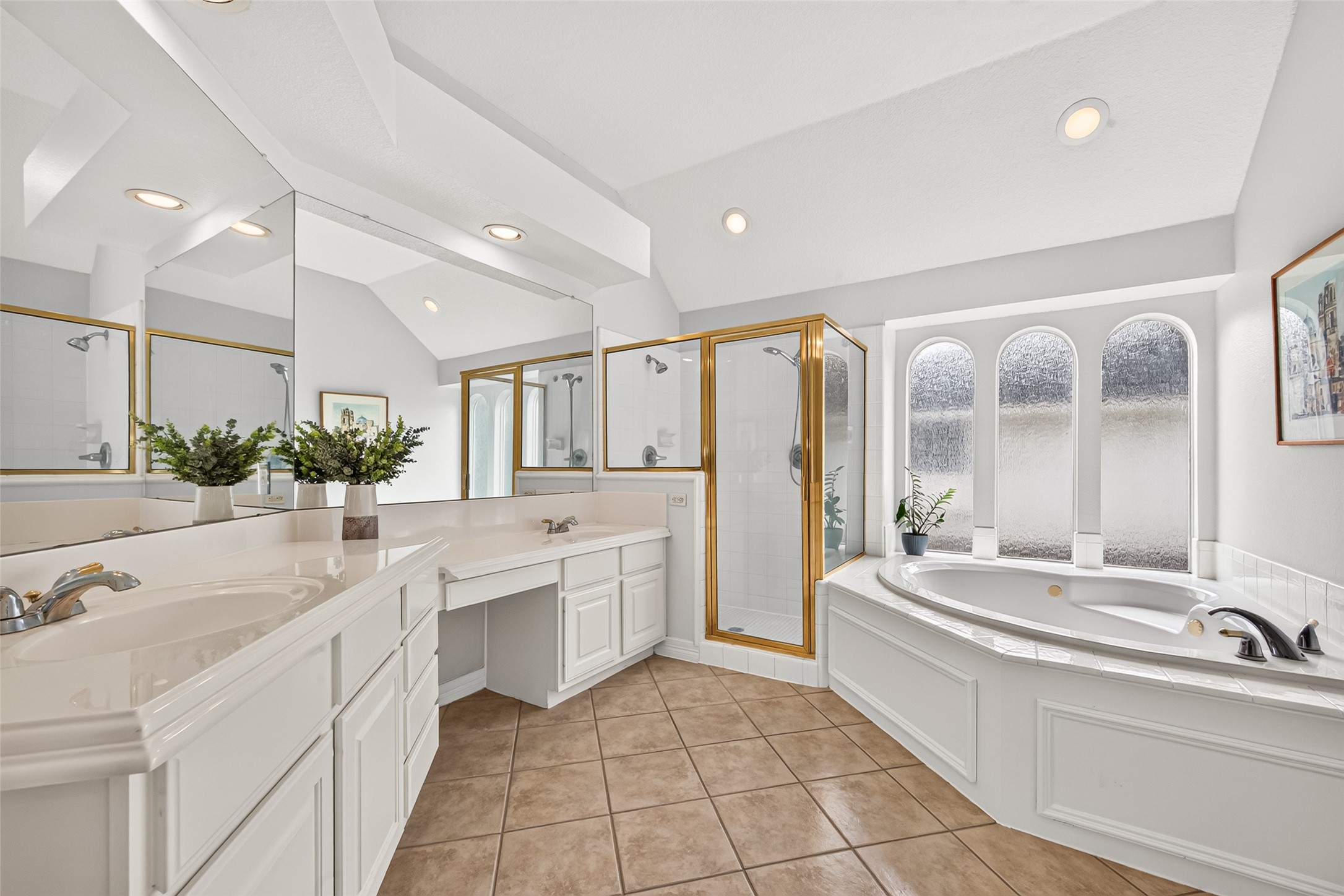 Primary bathroom featuring a spacious dual vanity,