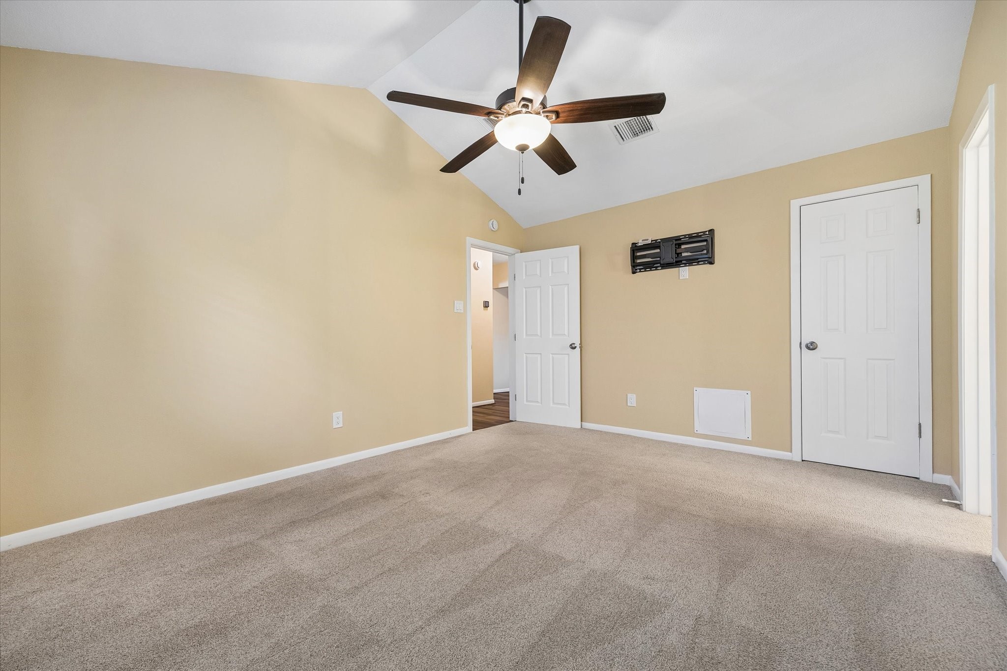 Imagine making this comfortable bedroom your own, with neutral finishes, soft carpeting, and space for your favorite furnishings.