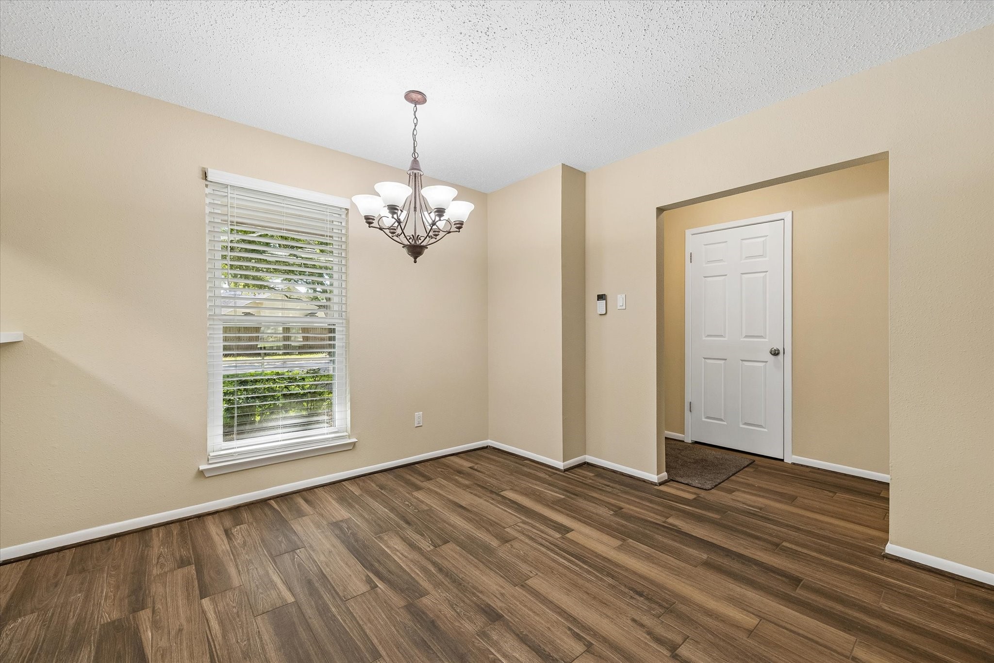 A cheerful dining space filled with natural light offers the perfect setting for morning coffee, family meals, and special occasions.
