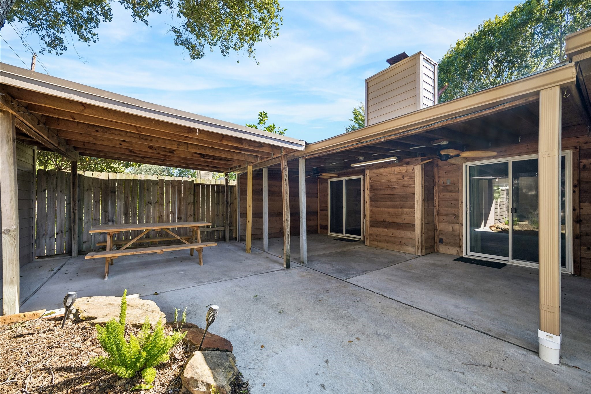 Your outdoor gathering spot awaits! Enjoy a covered patio with room for dining, relaxing, and spending time with friends and family.
