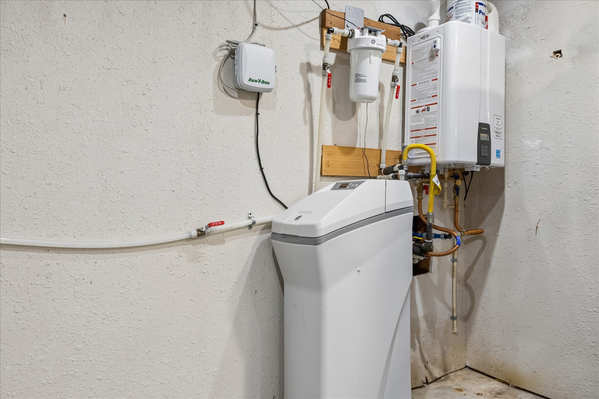 A dedicated utility area keeps essential home equipment conveniently tucked away in the garage.