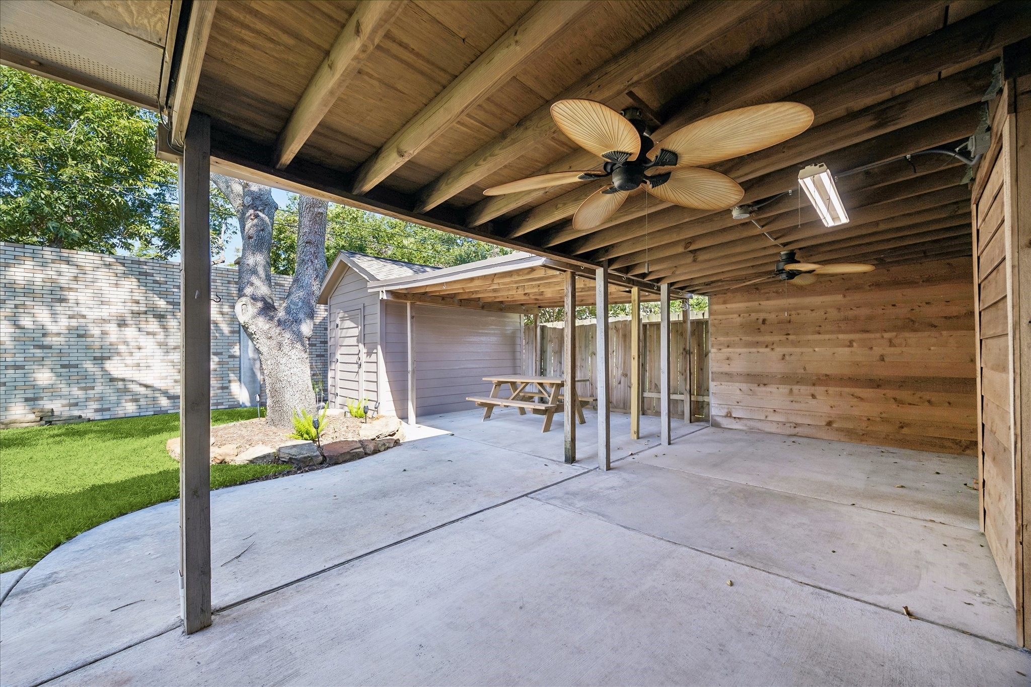 Rain or shine, enjoy a shaded outdoor retreat with room for seating, casual meals, and relaxing afternoons