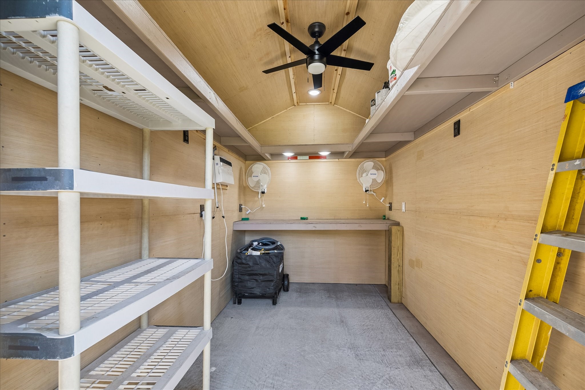 Need extra storage? This climate controlled storage shed offers built-in shelving and plenty of possibilities for keeping household essentials organized.
