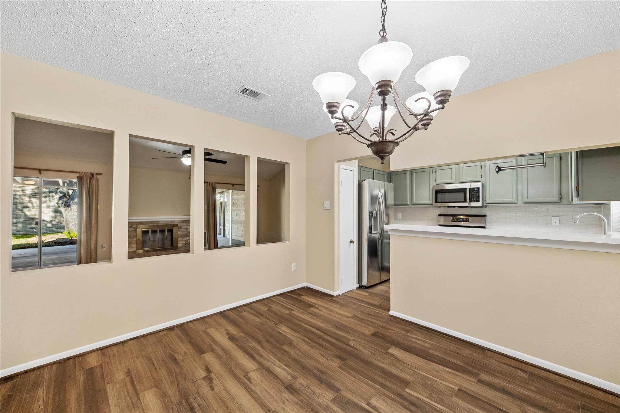Picture dinners with family and friends in this bright dining area, conveniently connected to the kitchen and adjoining living spaces.