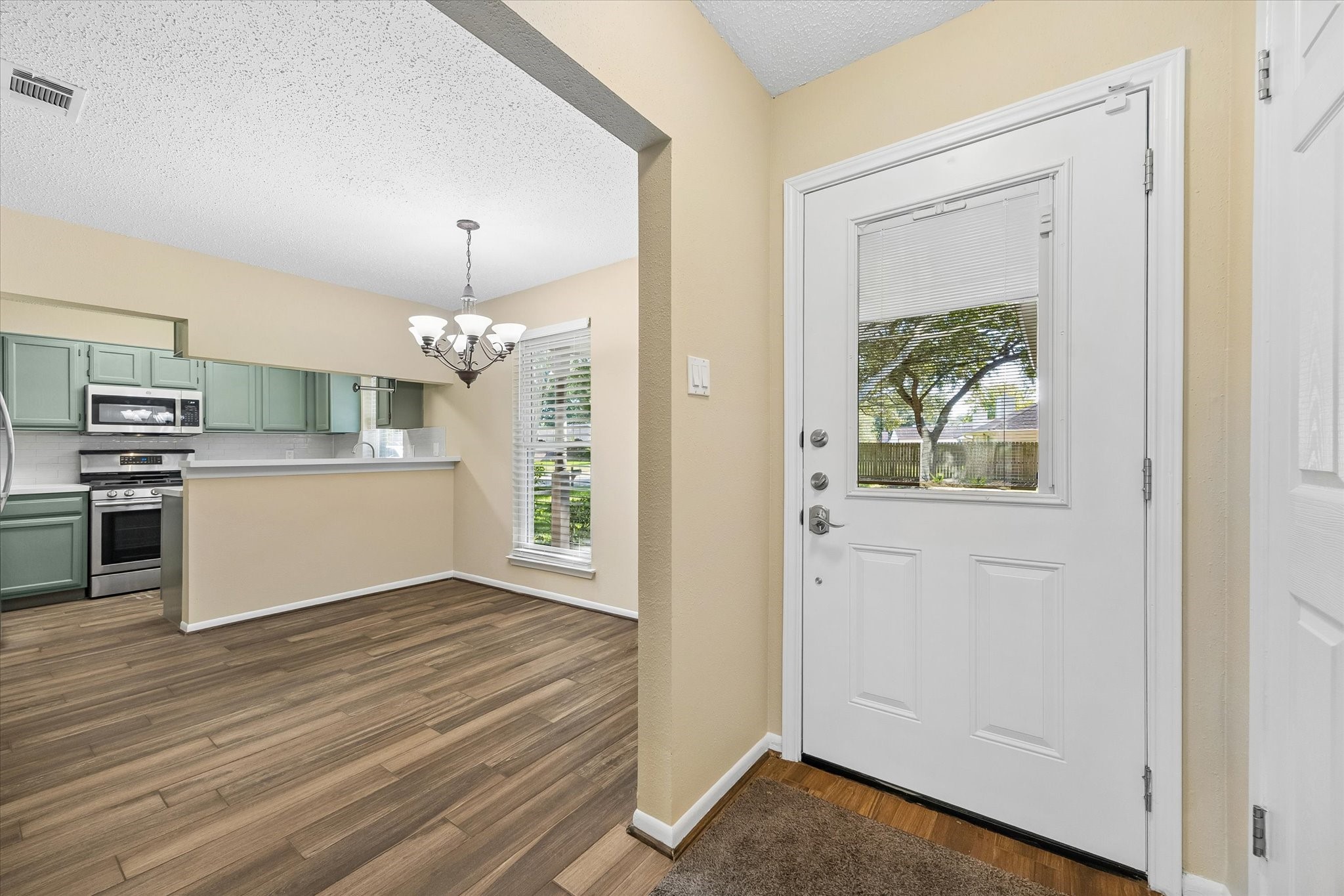 Step inside to an inviting layout where the dining area and updated kitchen connect beautifully, creating a comfortable space for everyday living.