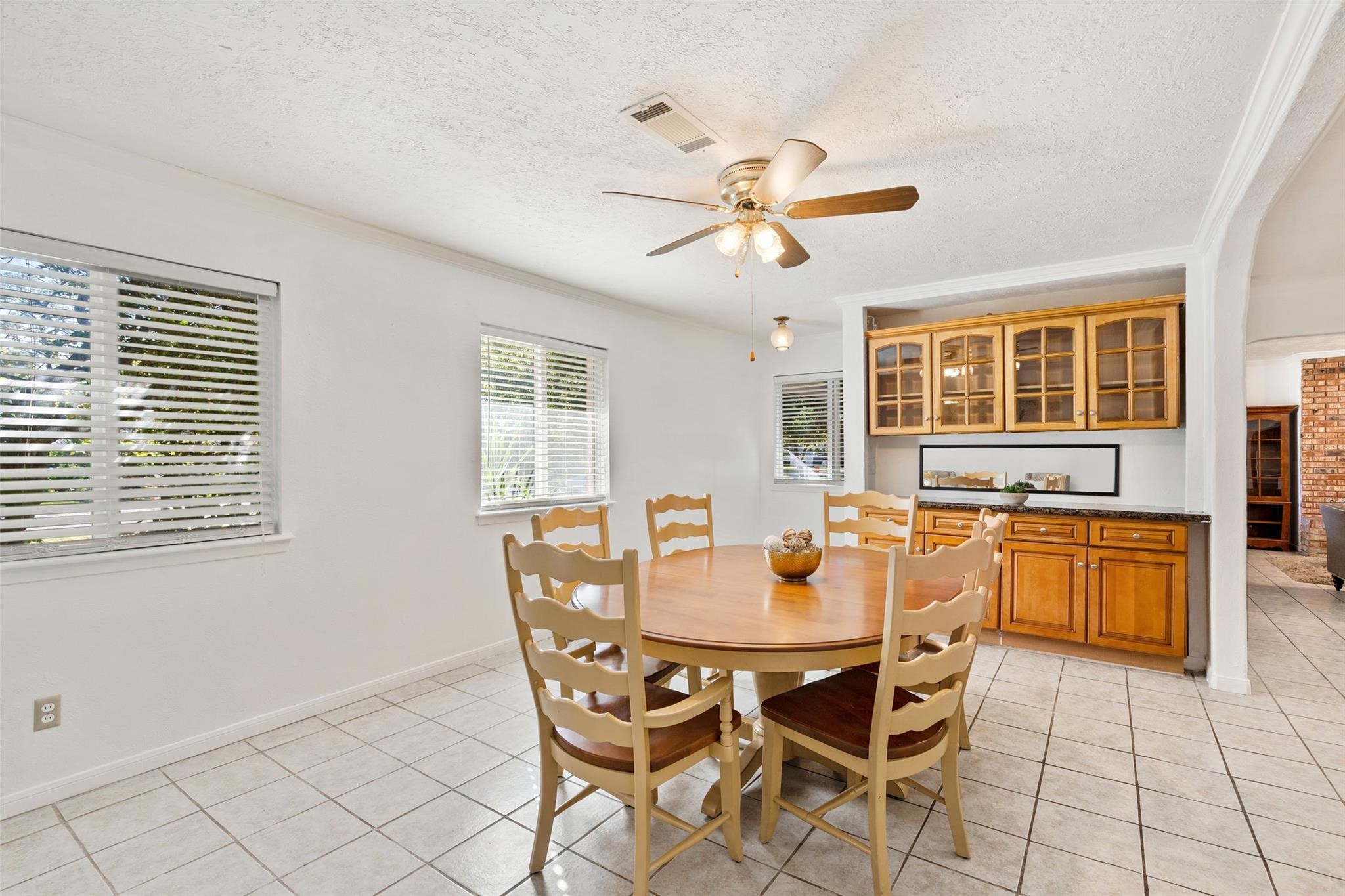 The beautiful dining room is the perfect place to gather anound a delicous meal! Large and bright windows offers great views to the front yard.*Home was previously furnished. There is currently no furniture in the home.