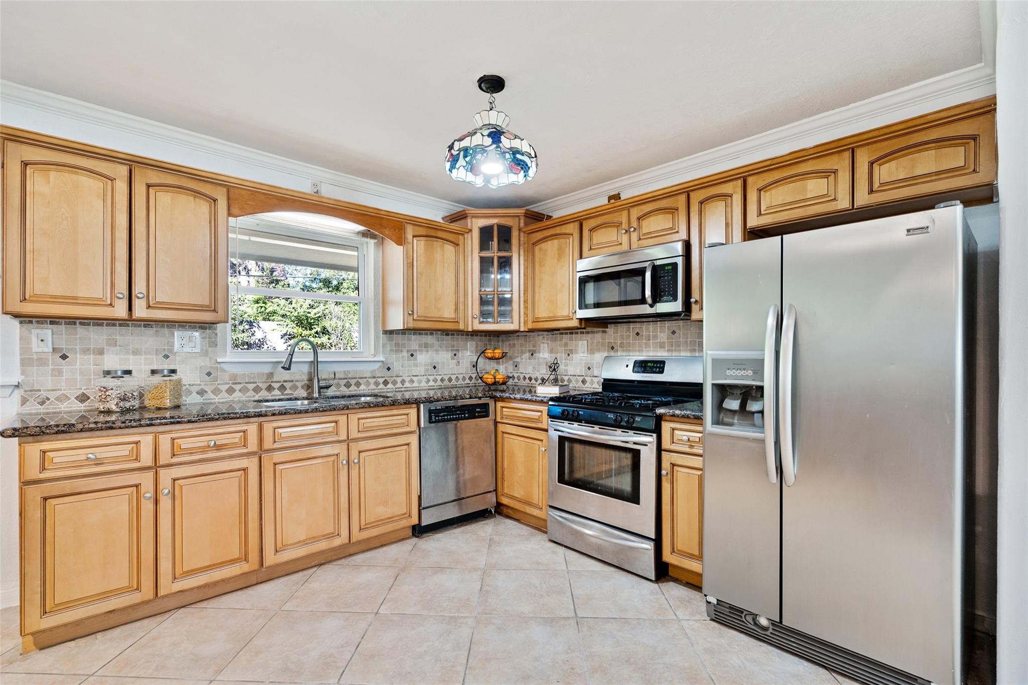 Modern cabinetry, updated light fixtures and stainless steel appliances make this kitchen the heart of the home!*Home was previously furnished. There is currently no furniture in the home.