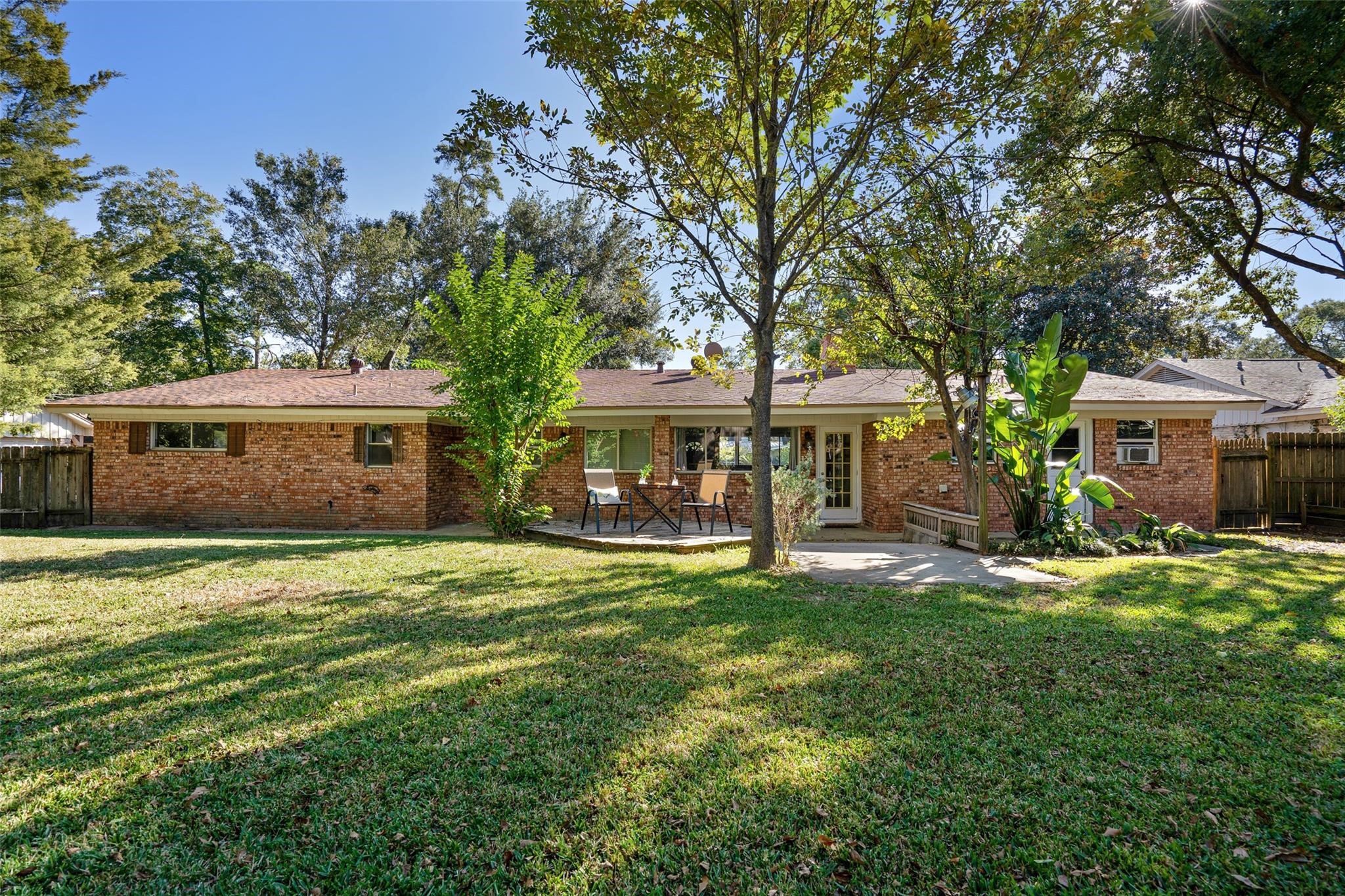 This home has a huge backyard with mature trees and lush landscaping!