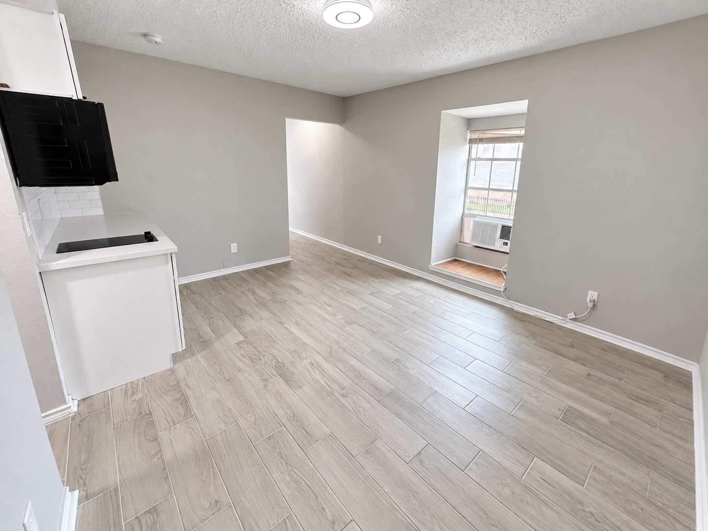 Bright studio interior with window and natural light.