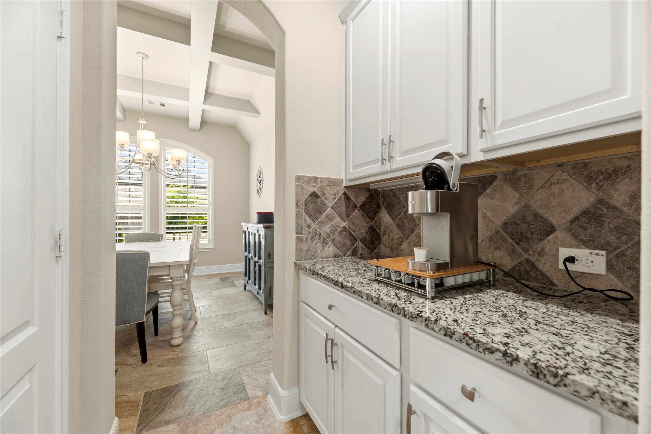 Between the kitchen and dining room is this convenient butler's pantry. The pantry is behind the door on the left.