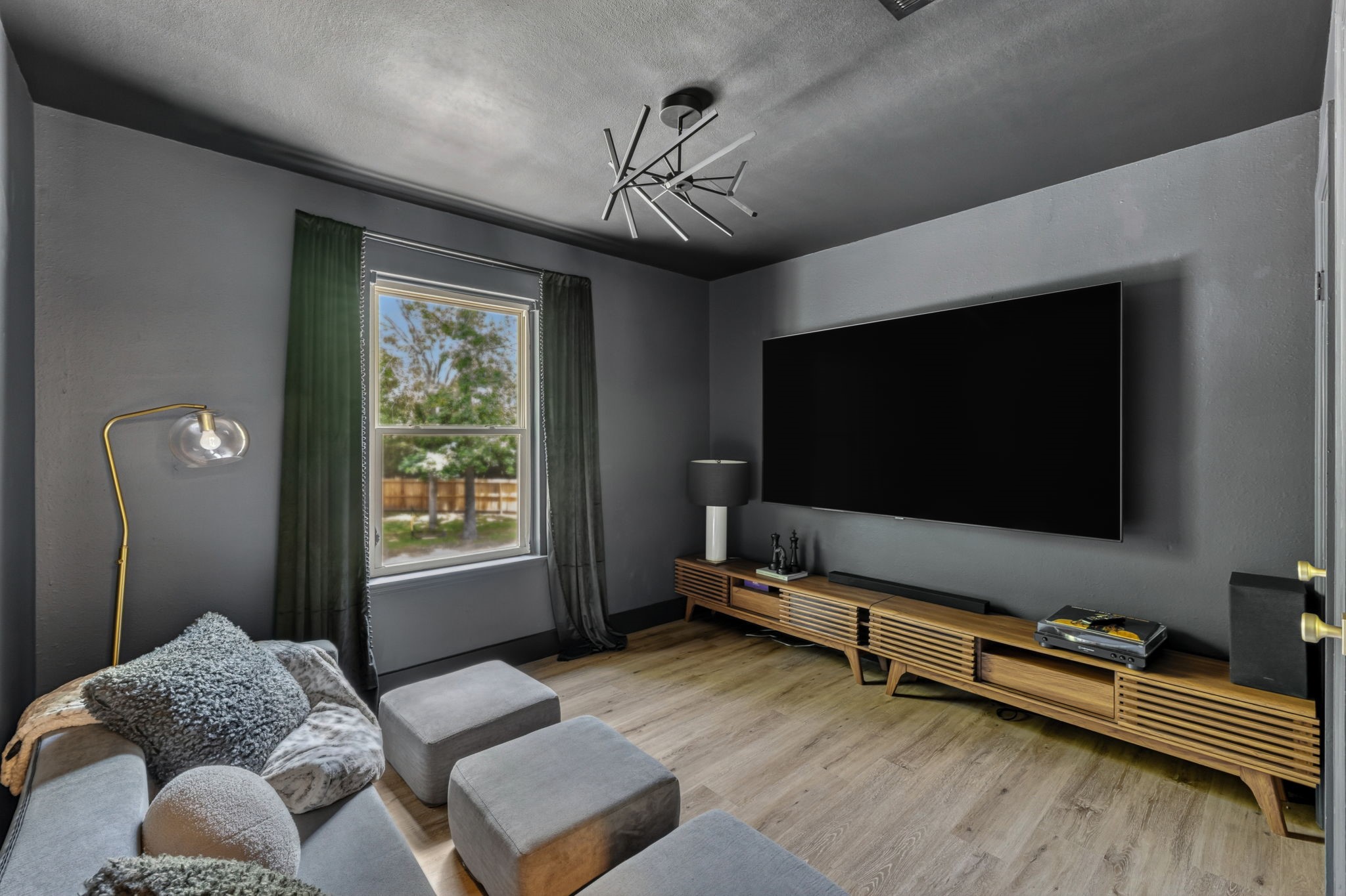 Bedroom to a fully transformed media room designed for immersive movie nights and game days alike