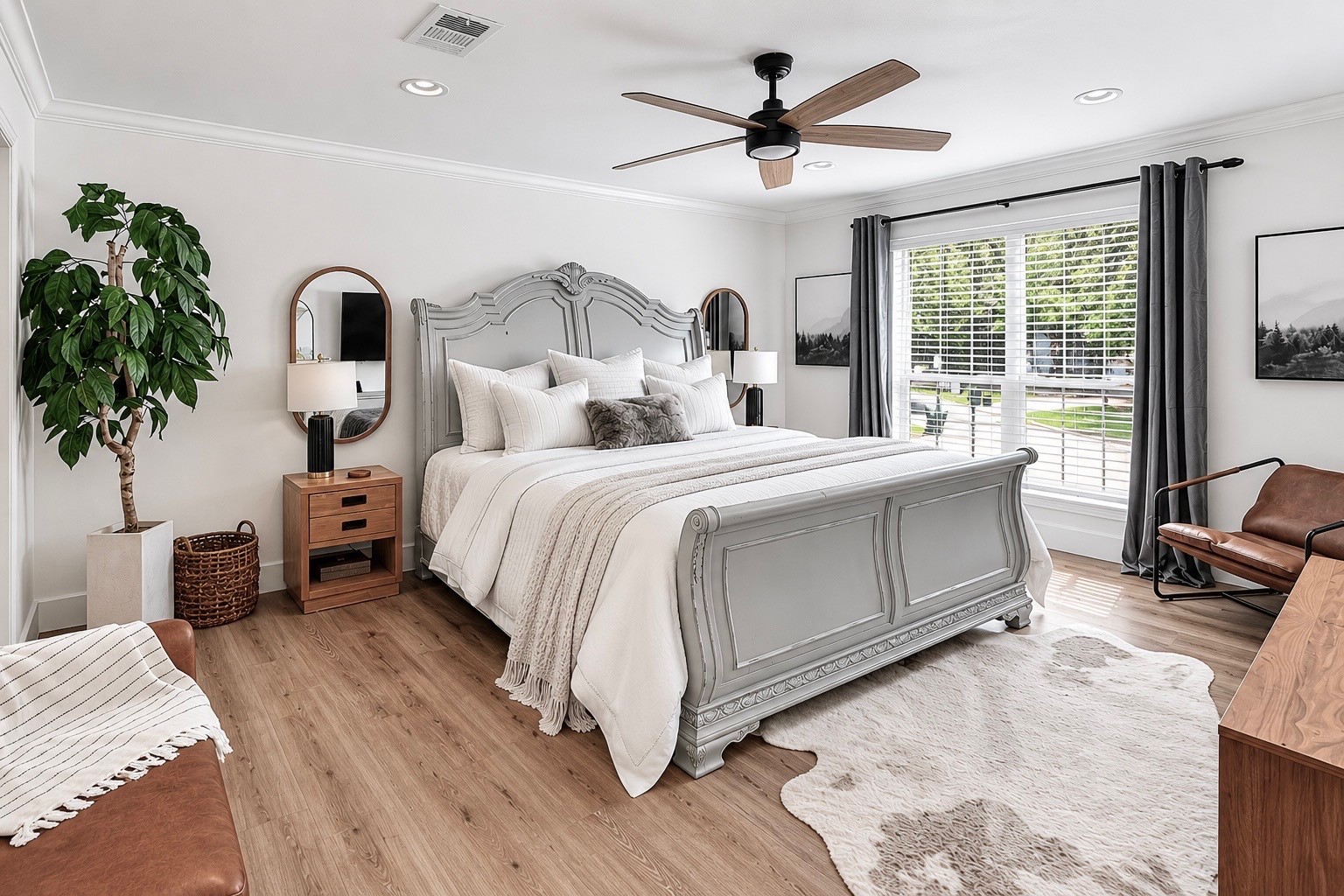 A spacious primary retreat filled with soft light and peaceful views