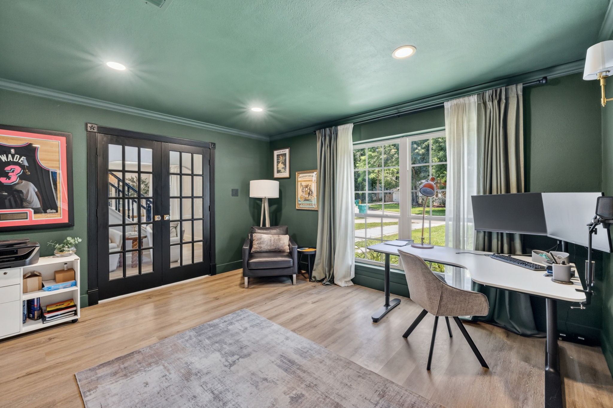 Striking black doors add contrast and character to the space