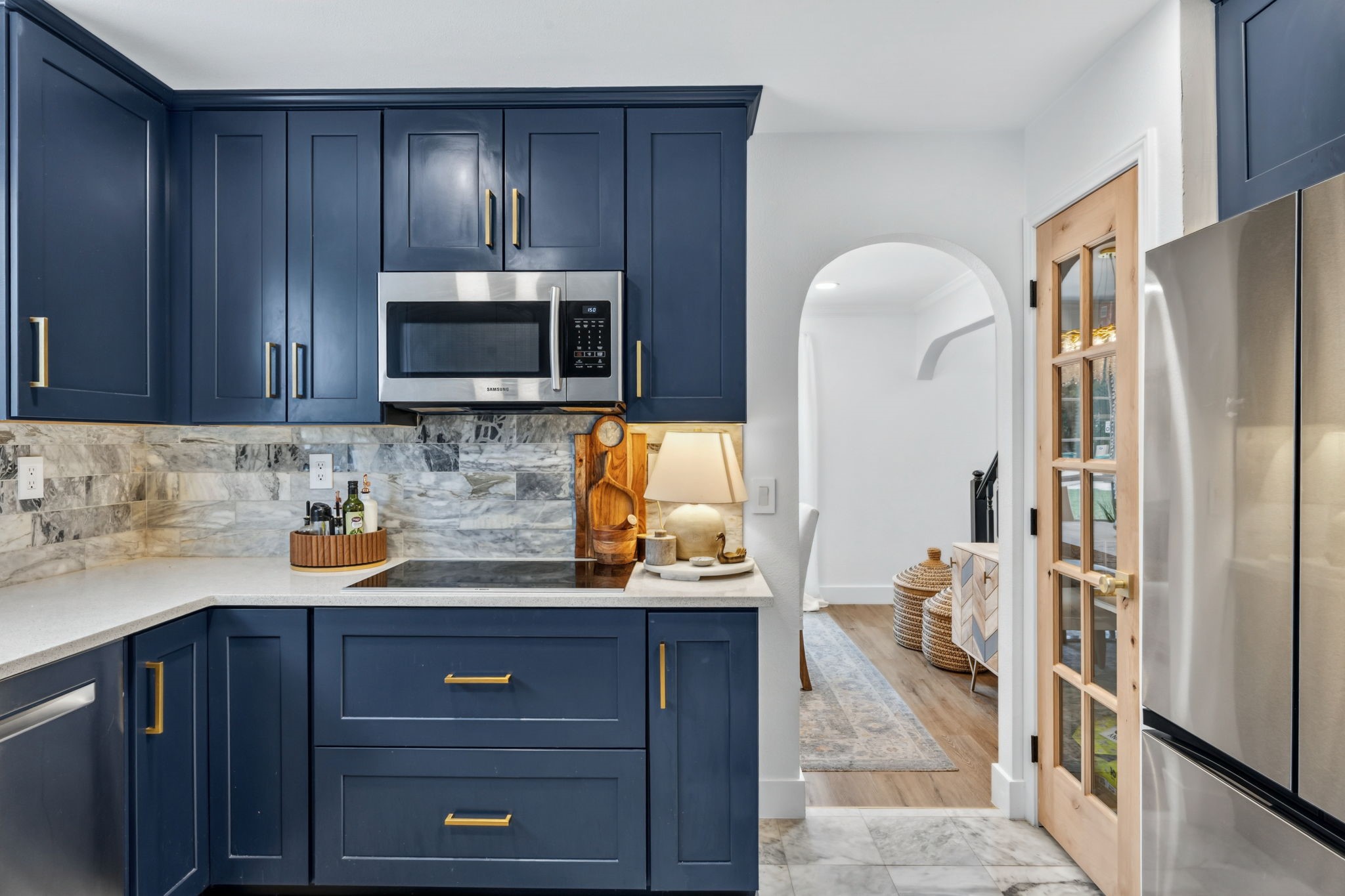 Thoughtfully updated with an induction cooktop, generous storage, and seamless flow