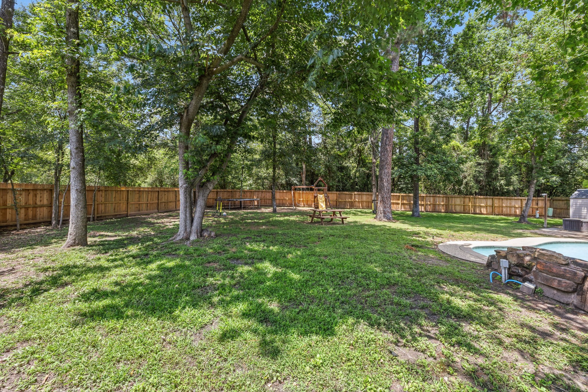 Set on an expansive 14,000+ sqft lot with room to gather, play, and entertain