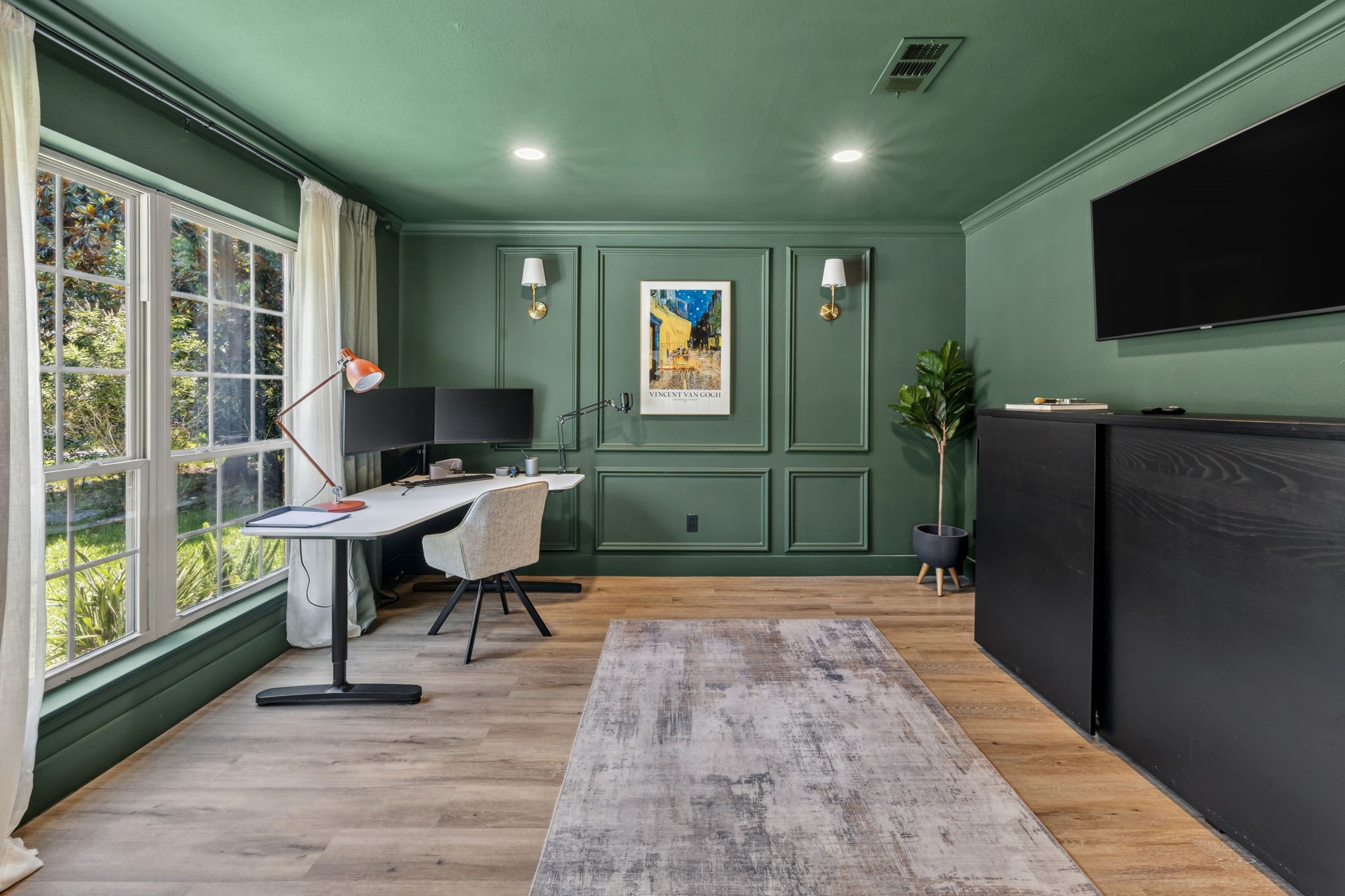 A moody green office designed to inspire focus, creativity, and calm
