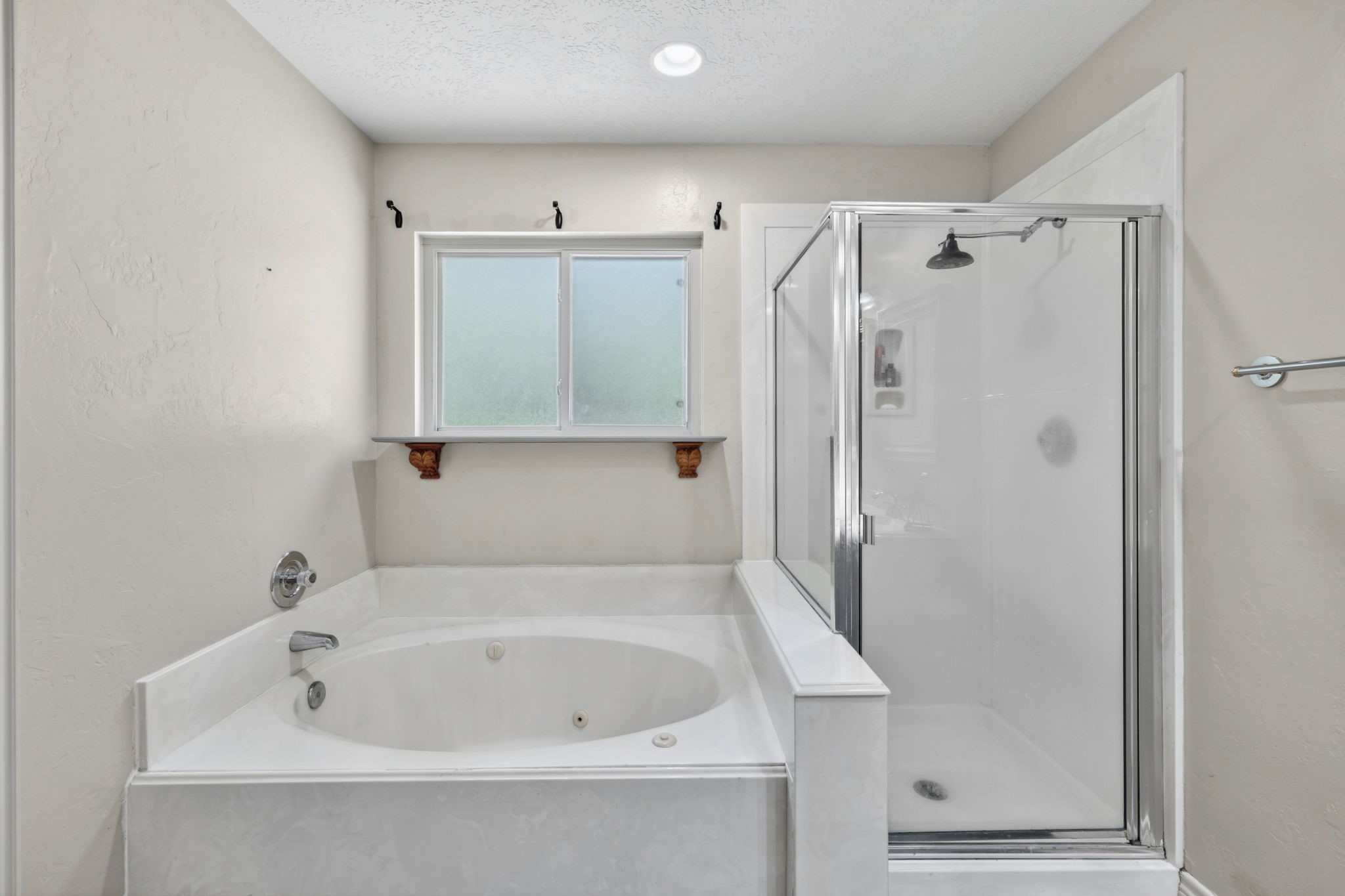 End the day with a jetted-soaking tub, walk-in shower