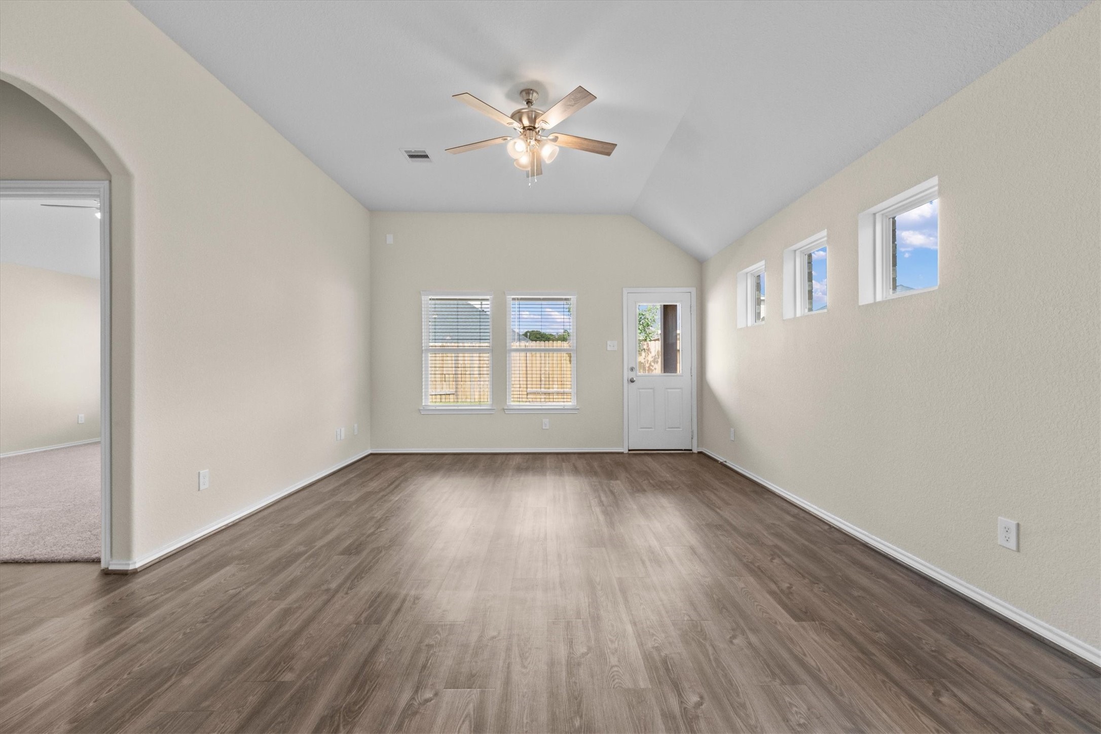 Family Room with lots of natural light and added ceiling fan
