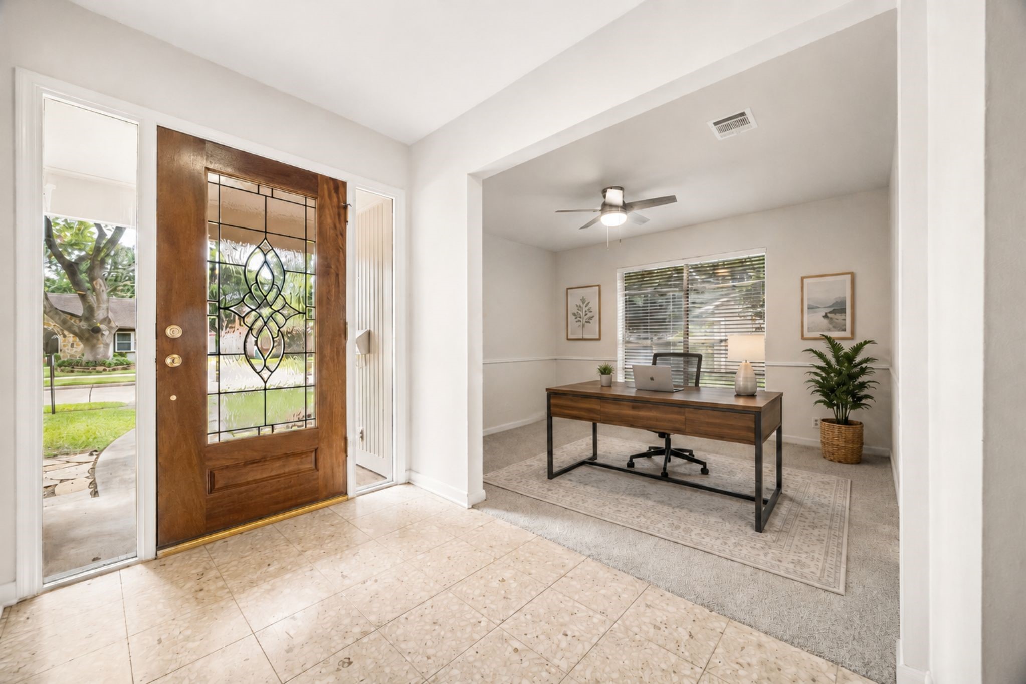 THE BRIGHT ENTRY FEATURES A DECORATIVE GLASS FRONT DOOR AND OPENS TO A PRIVATE STUDY WITH NATURAL LIGHT AND CHAIR-RAIL DETAILING. **Virtually Staged. THE BRIGHT ENTRY FEATURES A DECORATIVE GLASS FRONT DOOR AND OPENS TO A PRIVATE STUDY WITH NATURAL LIGHT AND CHAIR-RAIL DETAILING. **Virtually Staged.