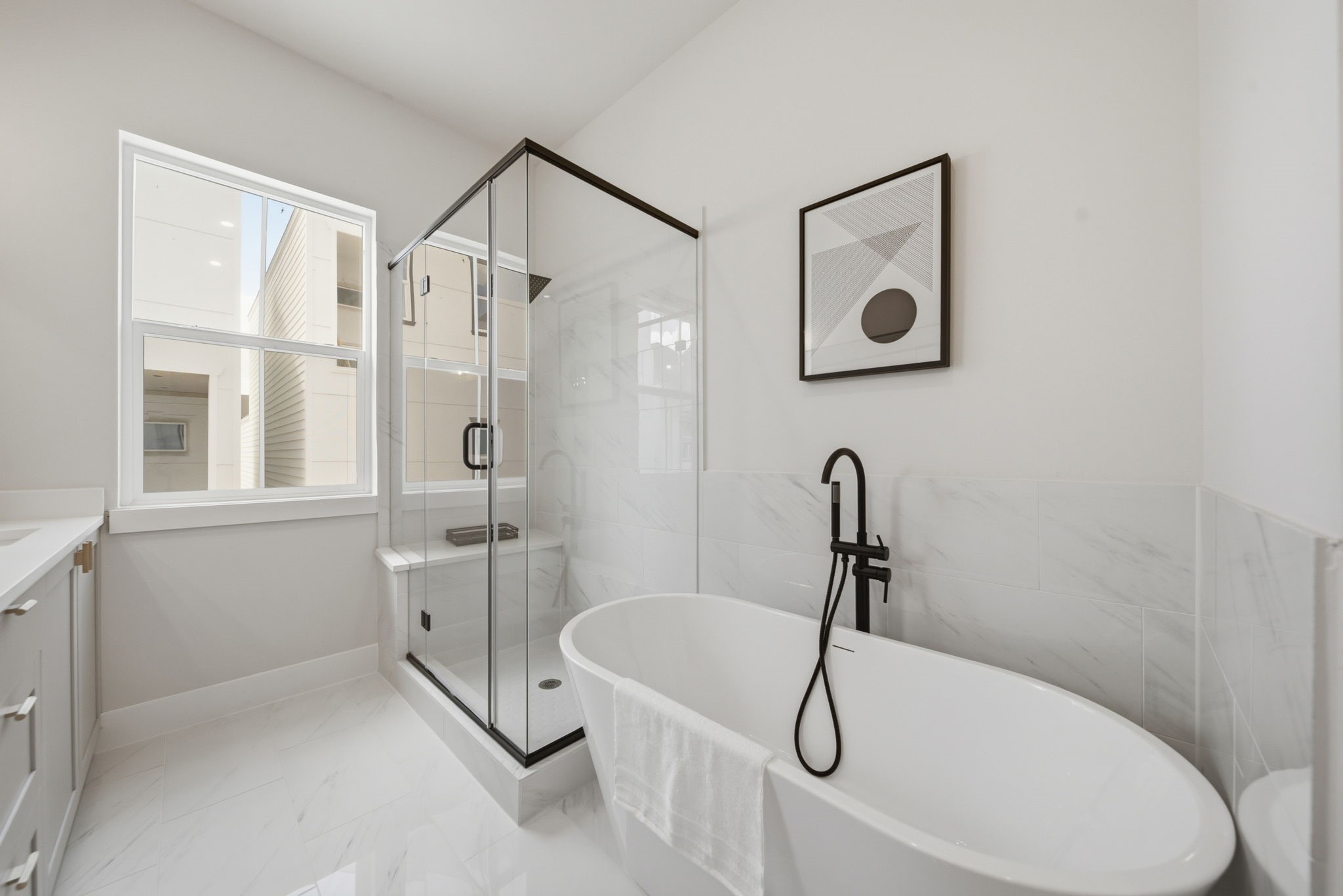 Luxurious stand alone garden tub and large walk-in shower with bench