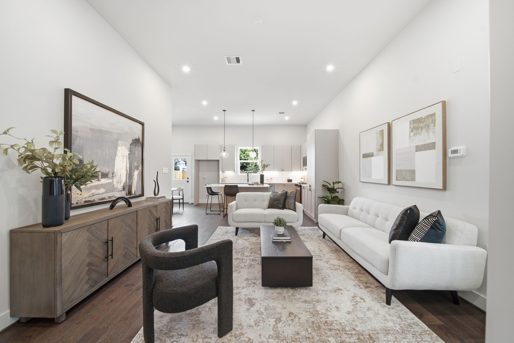 open-concept floor plan with high ceilings and abundant natural light